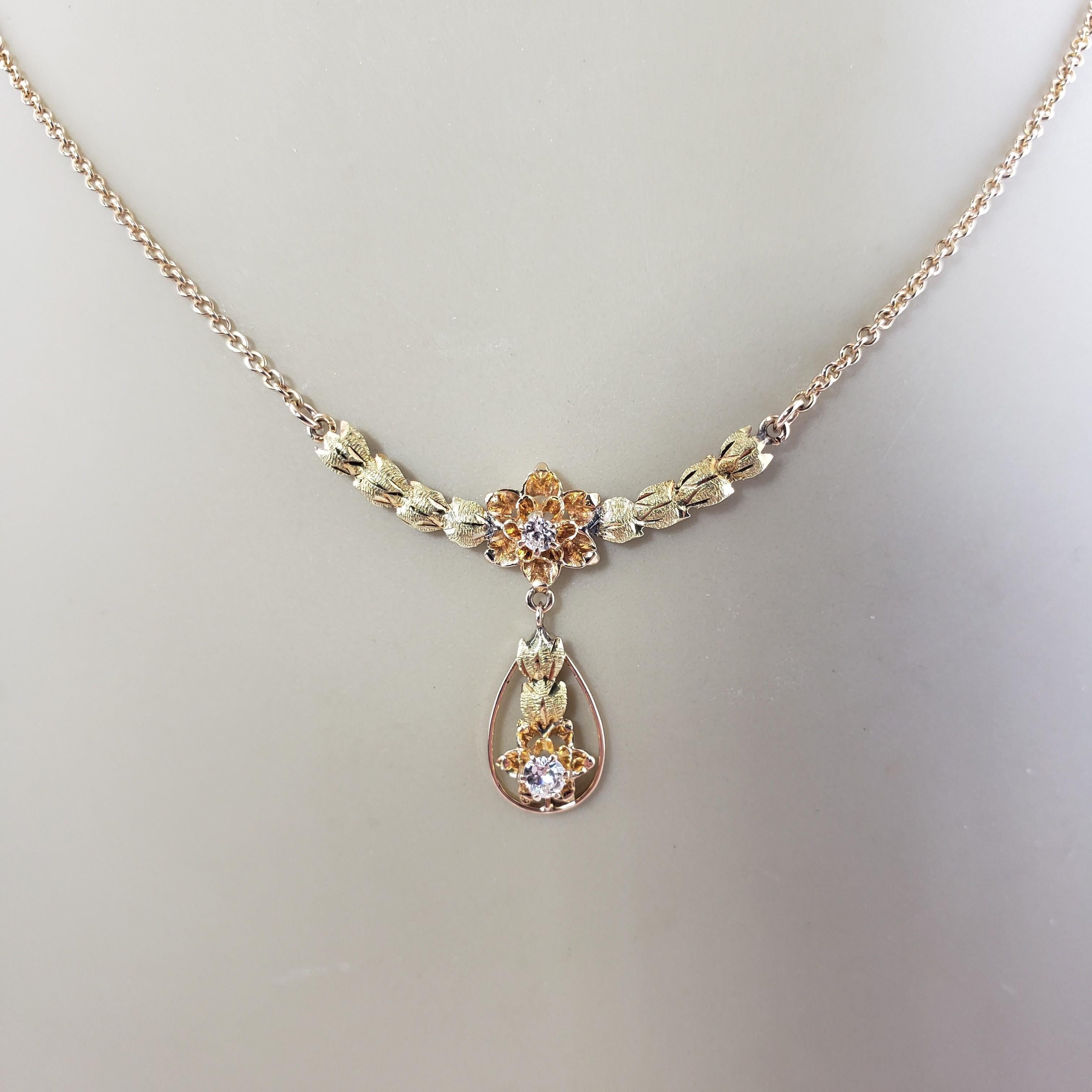 Vintage 14 Karat Yellow/Rose Gold and Diamond Floral Necklace-

This lovely floral necklace features two round brilliant cut diamonds* set in beautifully detailed 14K yellow and rose gold.

*Chip noted to diamond in drop not visible to naked