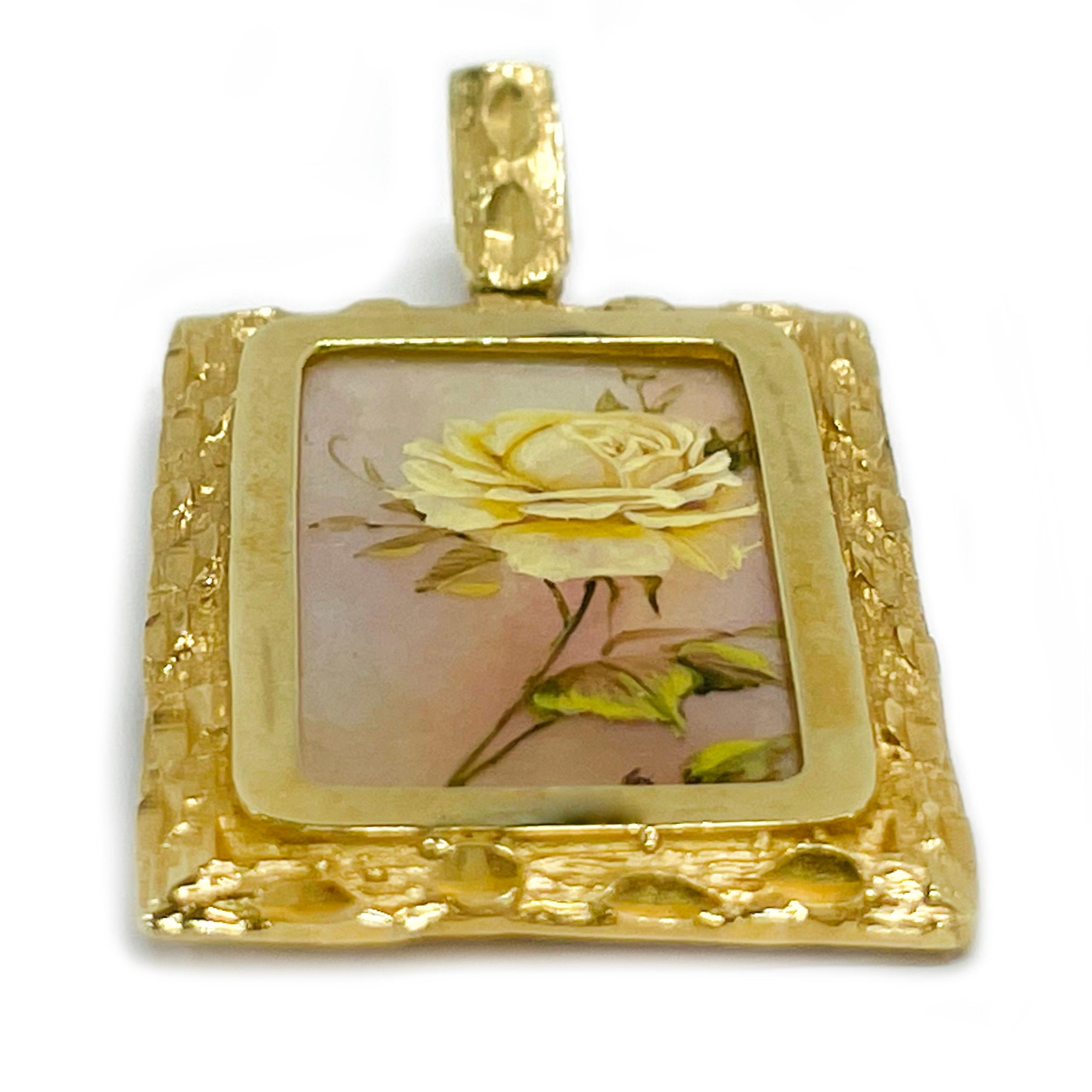 14 Karat Yellow Gold Hand Painted Yellow Rose on Mother of Pearl Pendant. Absolutely lovely Yellow Rose with Pink Background painting. The miniature painting is set in a 14 karat gold rectangular frame with diamond-cut details. The painting is