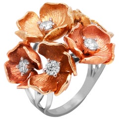 14 Karat Gelb-, Rosé- und Weißgold Ring mit fünf Blumen und Diamanten