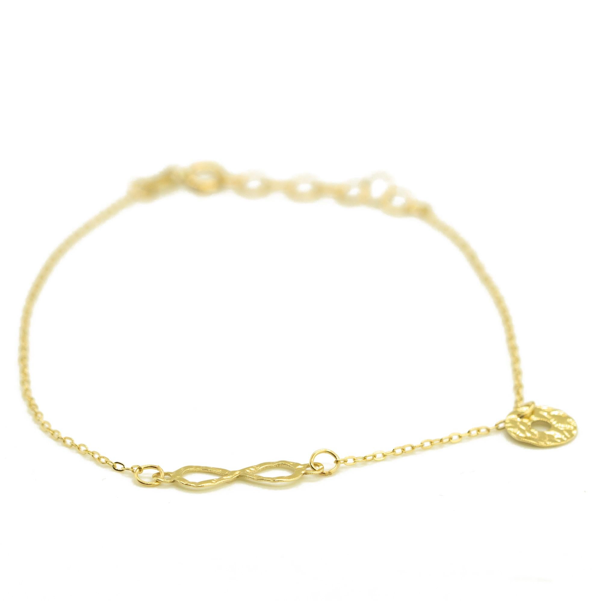 Art Nouveau Bracciale a catena con ciondolo del segno fortunato dell'infinito in oro giallo massiccio 14 carati in vendita