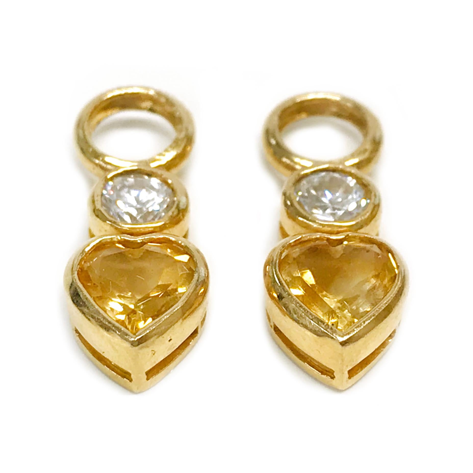 14 Karat Yellow Topaz Earring Jackets. These earring jackets consist of three bezels set vertically. The top bezel is round and open to place in hoop earrings, the second is a smaller round bezel with a round 4.2mm quartz stone and the last is a