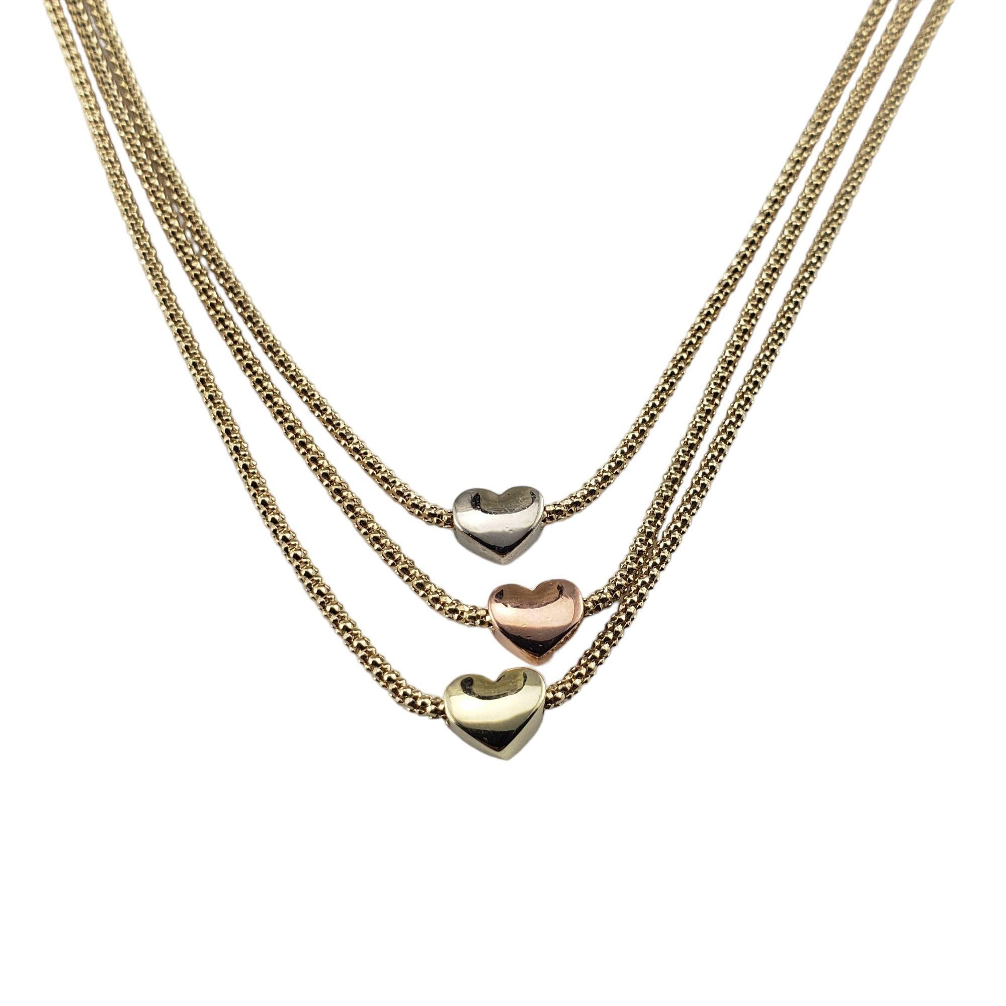  14 Karat Yellow, White and Rose Gold Heart Triple Row Layered Necklace-

This stunning triple row layered necklace features three hearts crafted in 14K yellow, white and rose gold. Set on three yellow gold wheat chains.

Size: 16.5