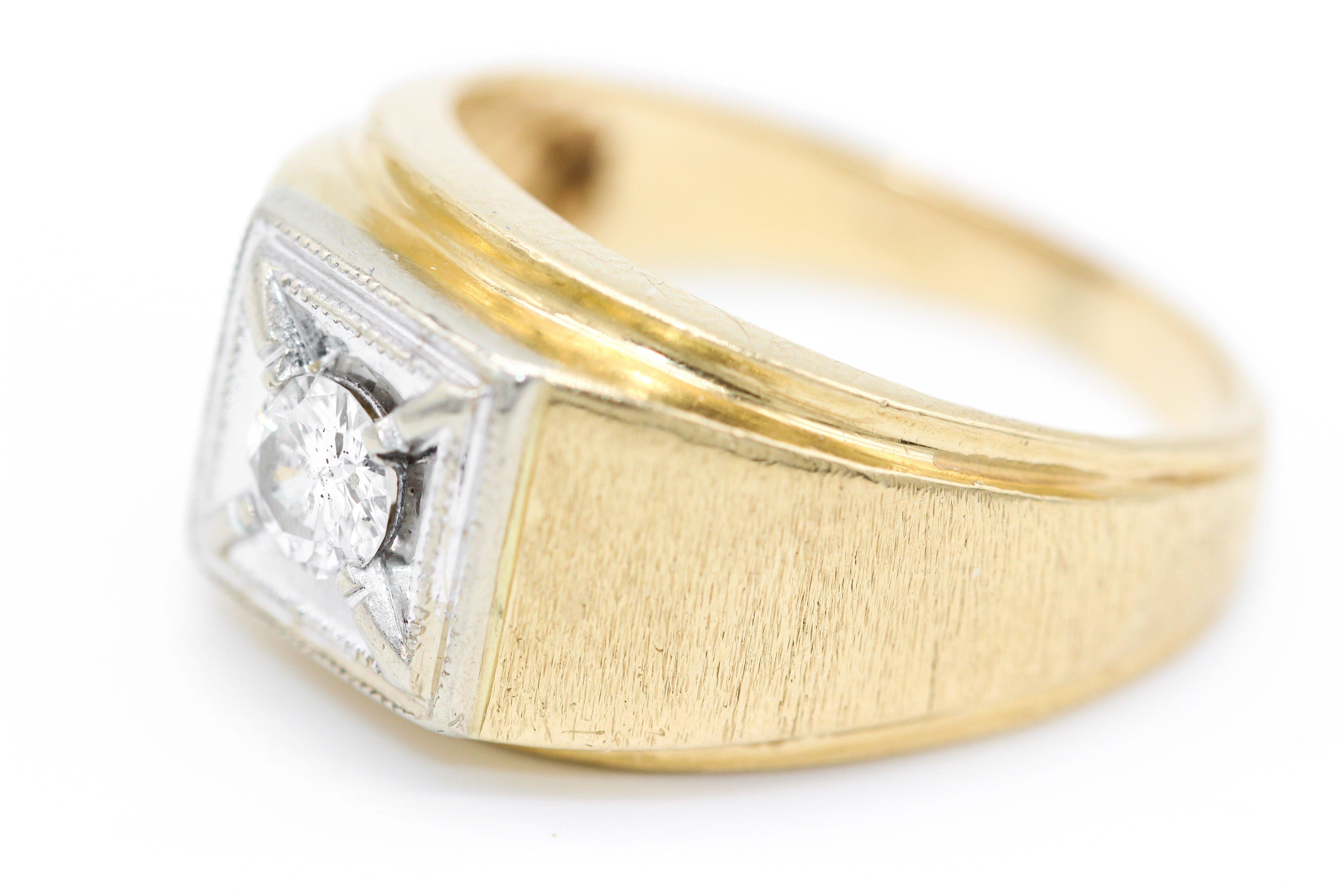 14 Kt yellow and white gold 0.38 Carat solitaire diamond gentlemen's signet ring. The brilliant cut diamond set in a square white gold panel and with brushed yellow gold shoulders.
Size UK  T    
        USA   9.63
Weight 8.5gm.     Diameter of face