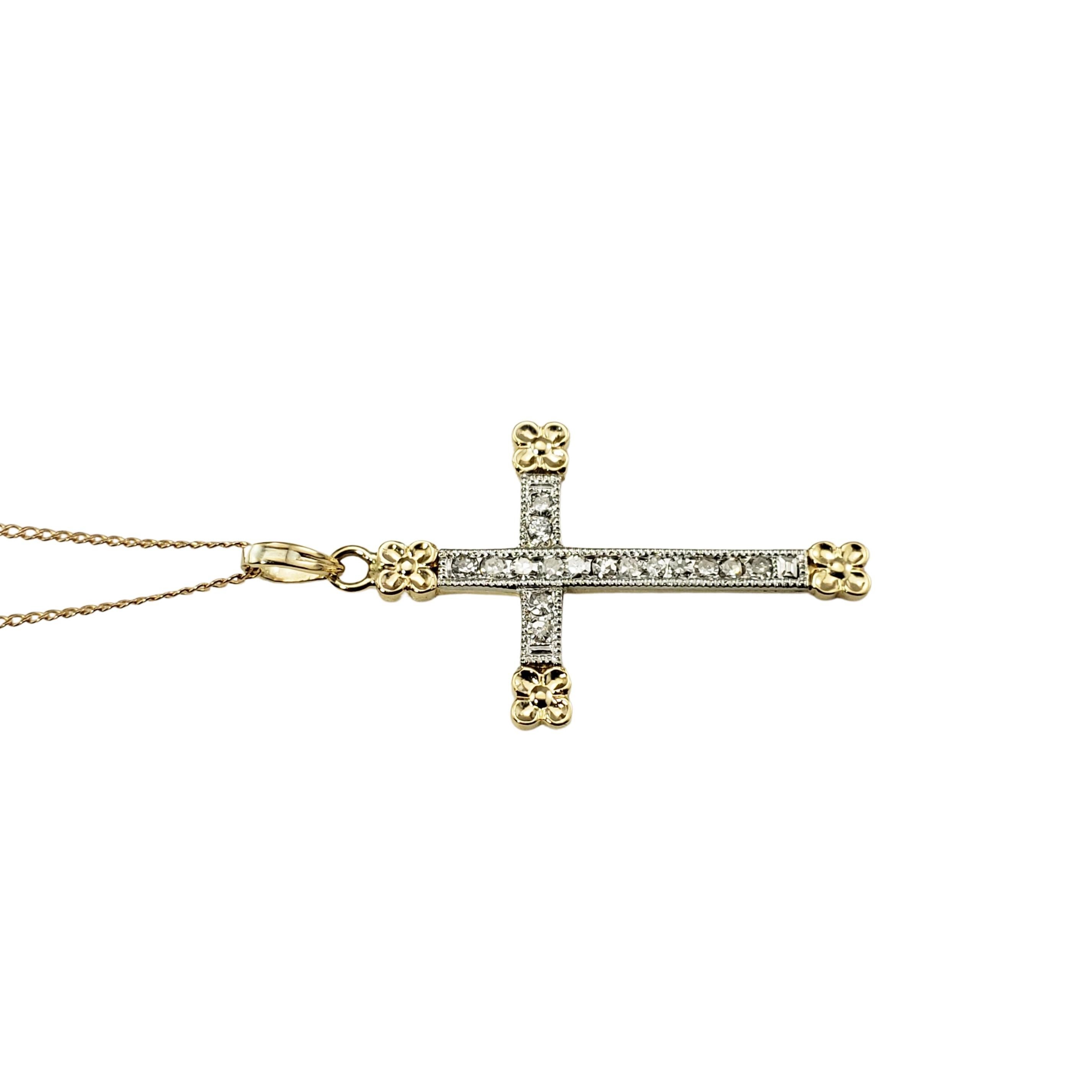 14 Karat Yellow/White Gold and Diamond Cross Pendant Necklace-

This sparkling cross pendant features 18 round single cut diamonds set in beautifully detailed 14K yellow and white gold.  Suspends from a classic cable necklace.

Approximate total