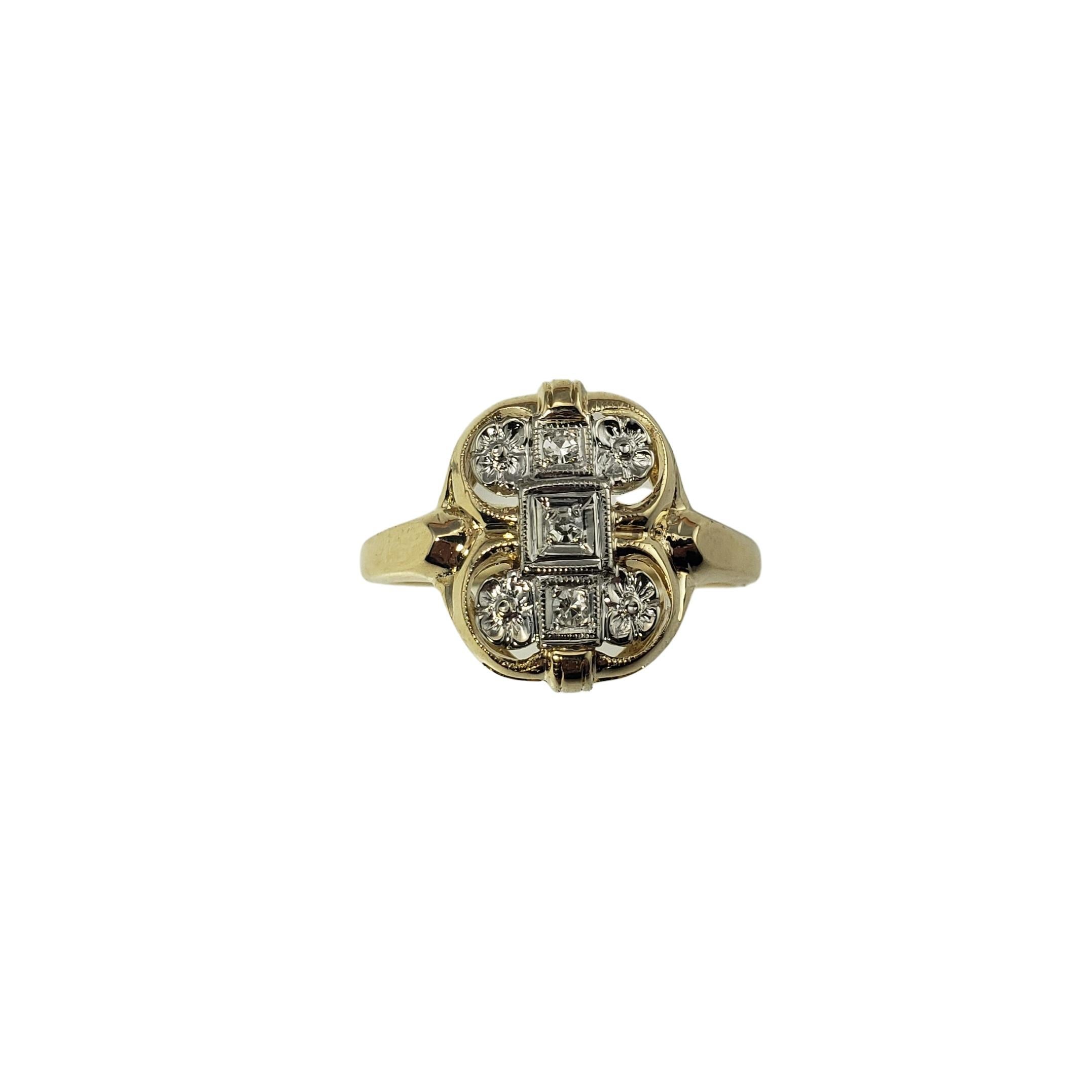 This lovely ring features three round single cut diamonds set in beautifully detailed 14K yellow and white gold. Width: 15 mm.

Shank: 2 mm.

Approximate total diamond weight: .06 ct.

Diamond clarity: SI1

Diamond color: I

Ring Size: 8.75

Weight: