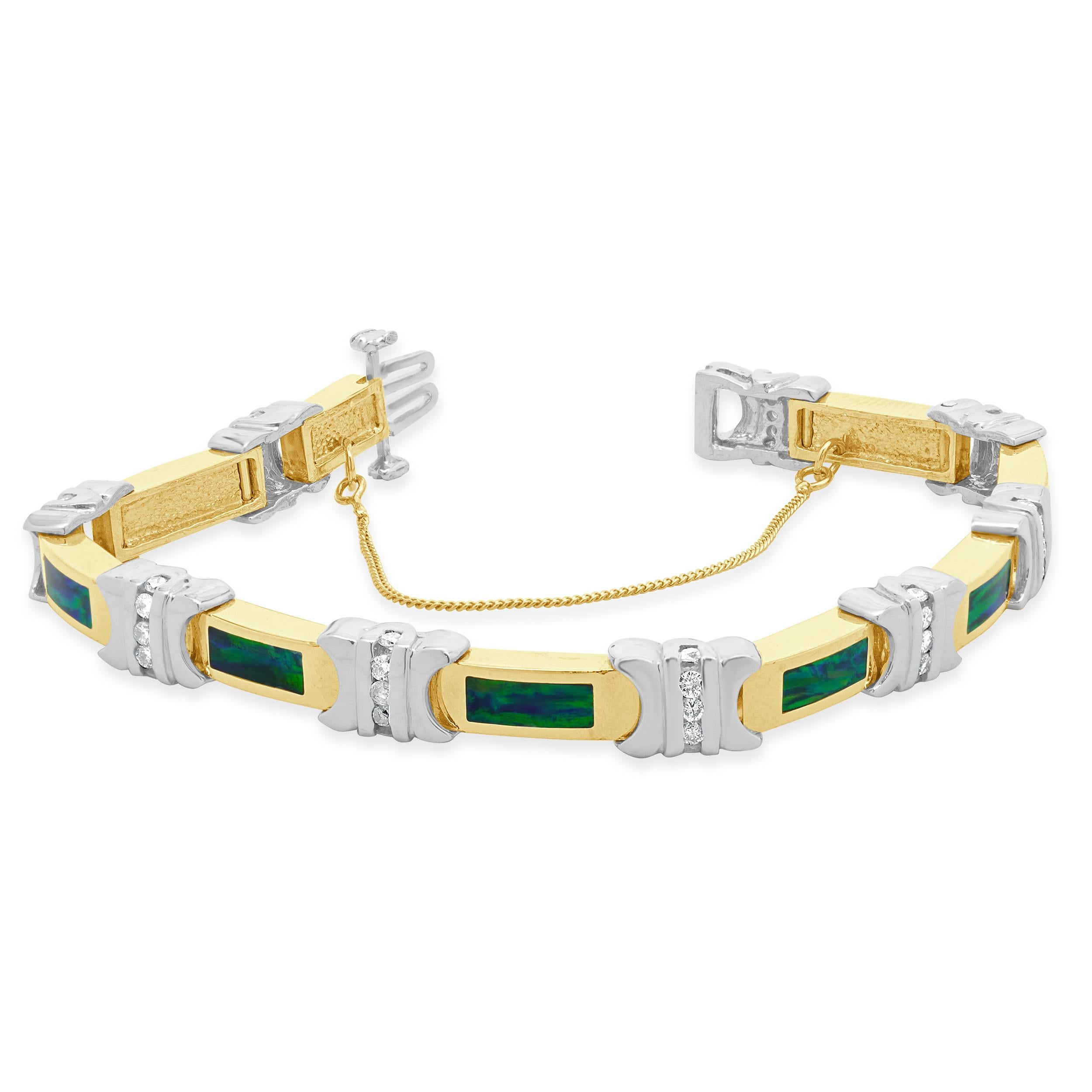 Diseñador: custom
Material: Oro amarillo y blanco de 14 quilates
Diamante: 45 talla brillante redonda = 0,90cttw
Color: I
Claridad: I1
Longitud: la pulsera se ajusta a una muñeca de hasta 7 pulgadas
Peso: 30,27 gramos
