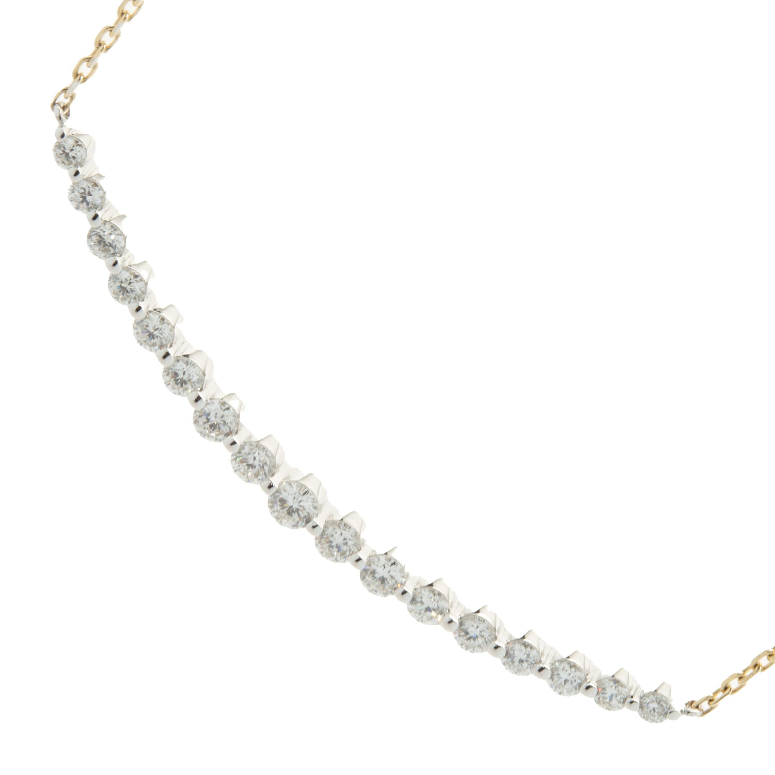 Designer: custom design
Material: 14K yellow & white gold
Diamond: 17 round brilliant cut = 1.43cttw
Color: G
Clarity: VS2
Dimensions: necklace measures 18-inches in length 
Weight: 4.62 grams
