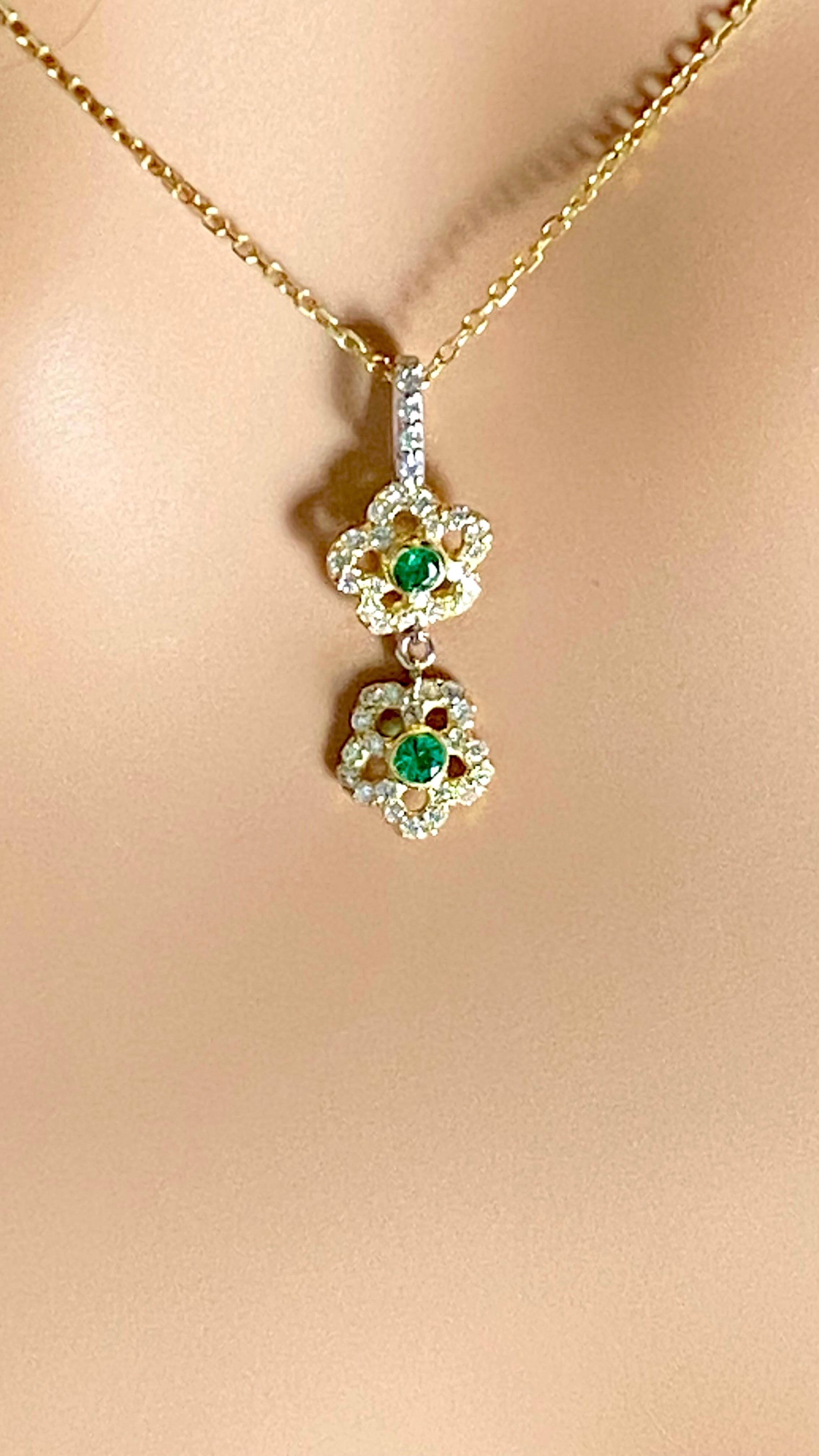 Round Cut 14 Karat Yellow White Gold Floral Pendant Necklace with Emeralds and Diamonds For Sale