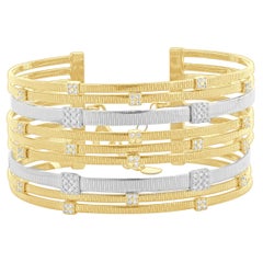 14 Karat Yellow 
White Gold Nine Row Diamond Station Cuff Bracelet