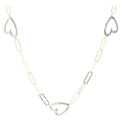 Collier station cœur ouvert en or jaune et blanc 14 carats