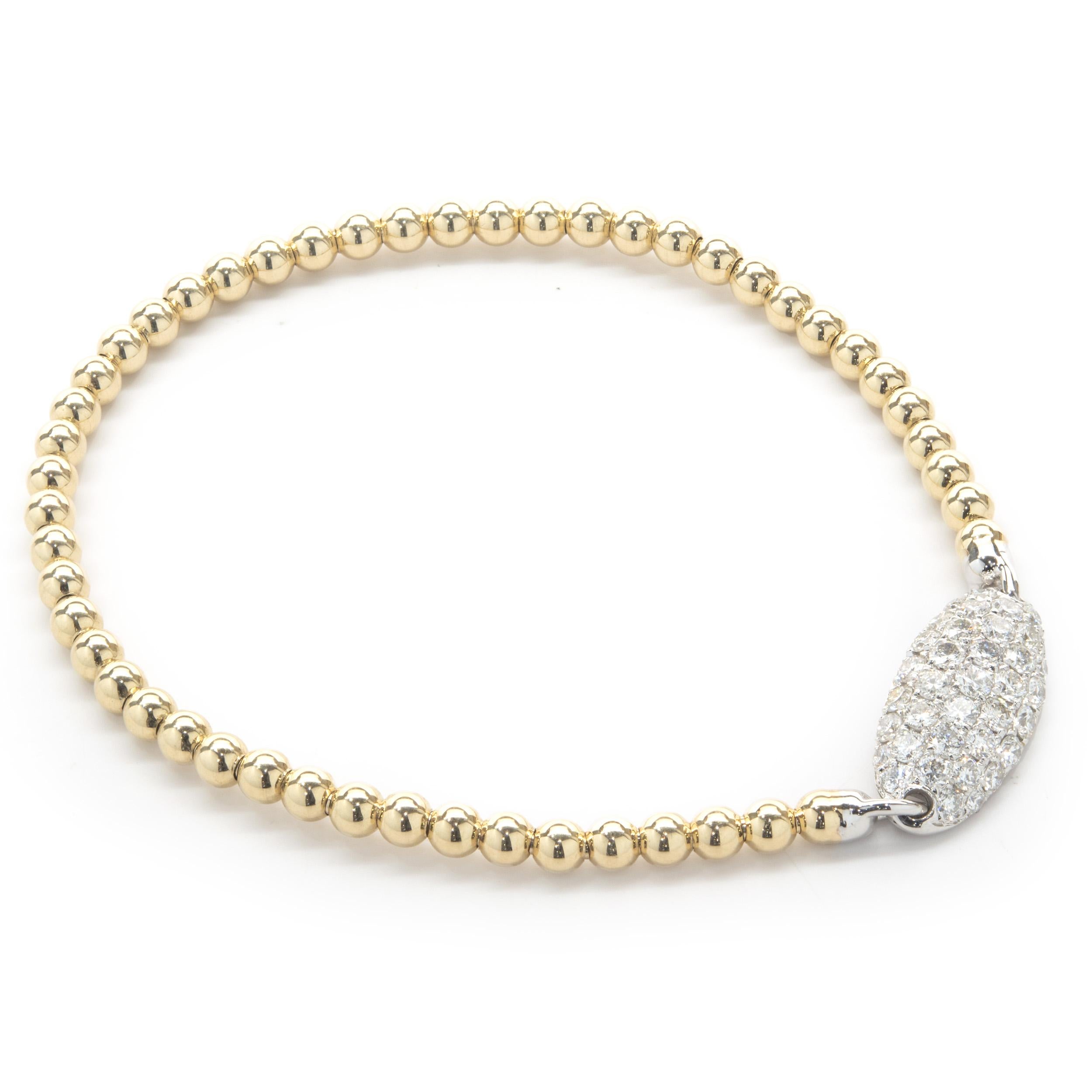 Material: 14K yellow & white gold
Diamonds:  round brilliant cut = 1.11cttw
Color: G 
Clarity: SI1
Dimensions: bracelet will fit up to a 7-inch wrist 
Weight: 5.11 grams