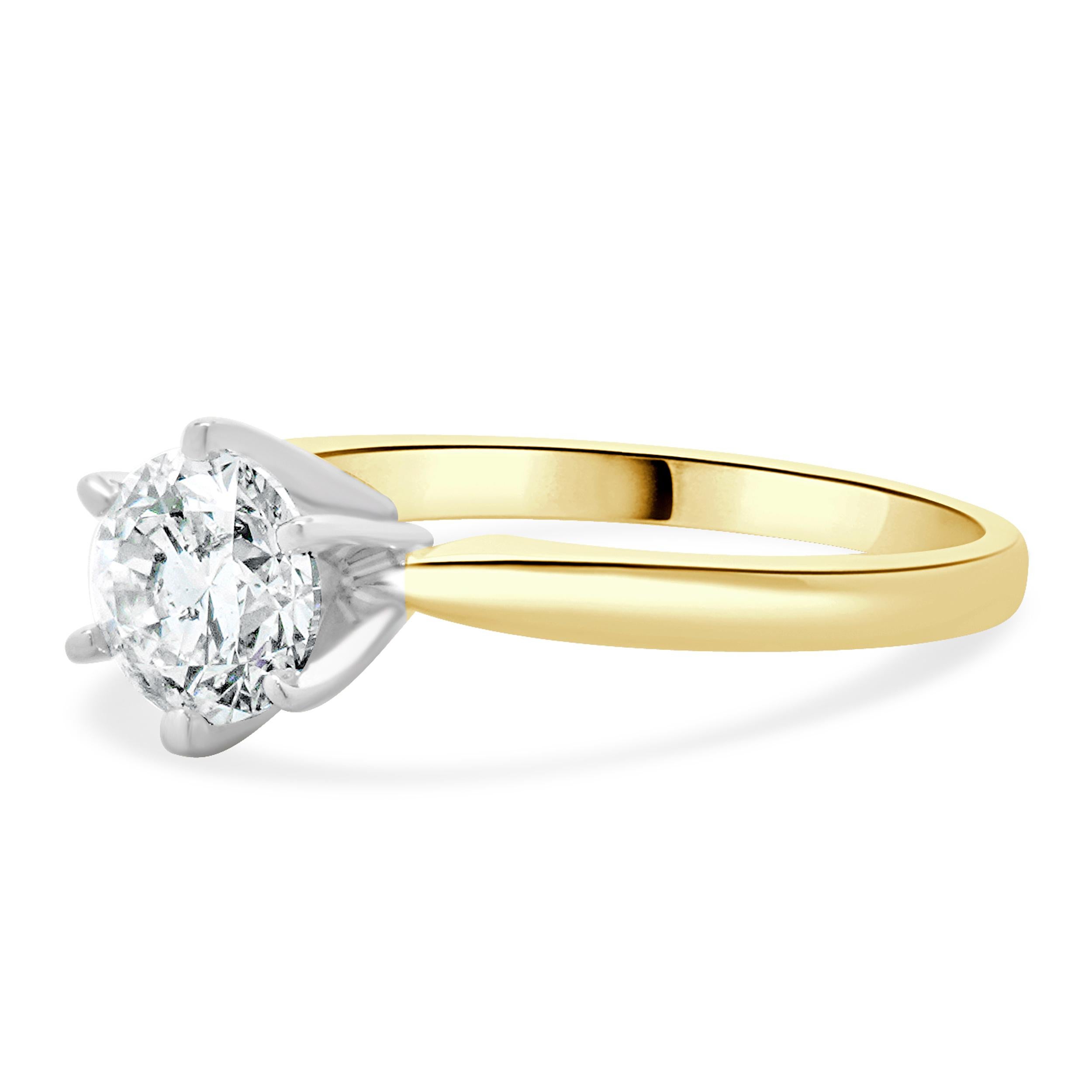Designer: custom
Material: 14K yellow & white gold
Diamond:  1 round brilliant cut = 1.02ct
Color: I
Clarity: I2
Dimensions: ring top measures 6.31mm wide
Ring Size: 7 (complimentary sizing available)
Weight: 2.57 grams
