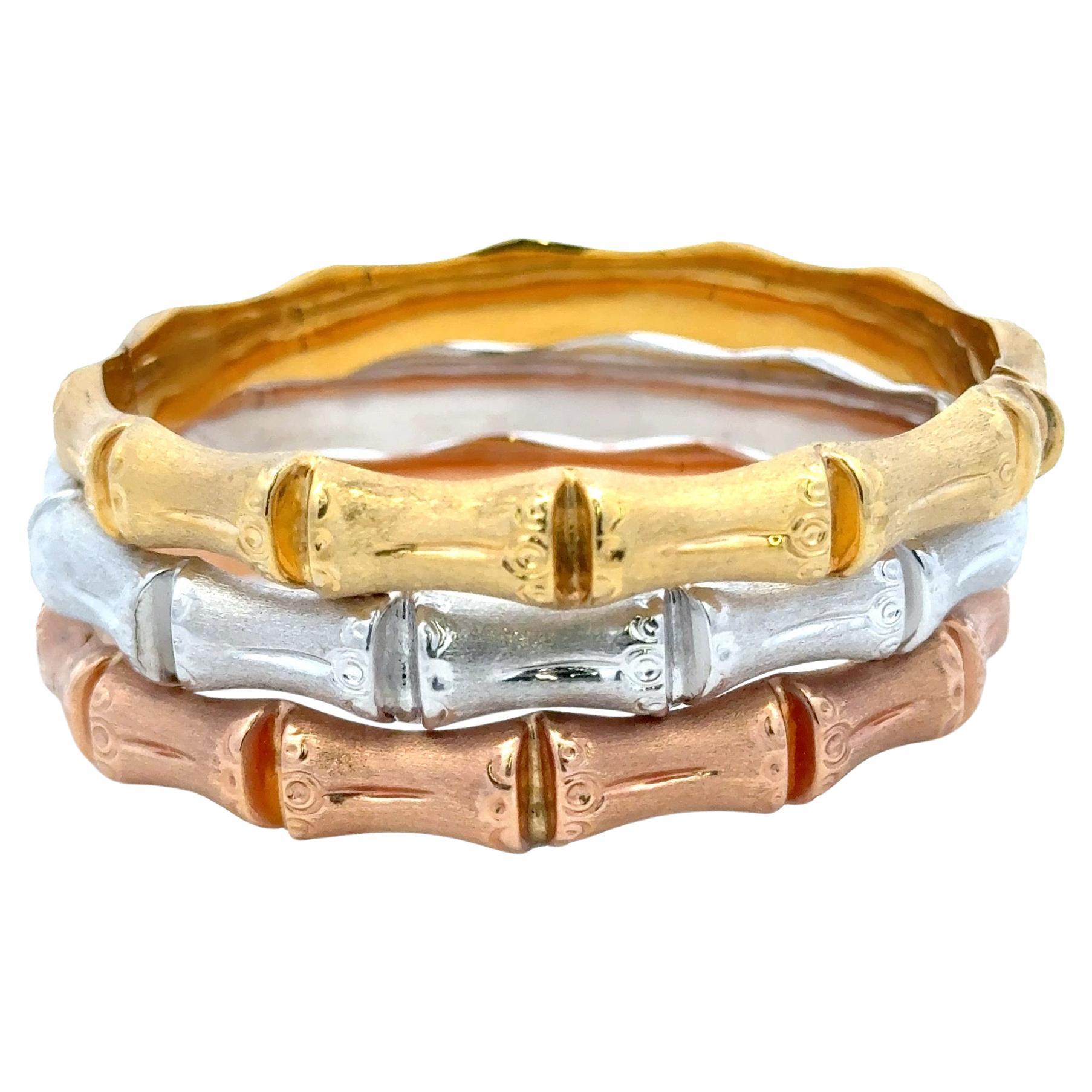 Collection de bracelets en or jaune, rose et blanc 14 carats à motif de bambou pesant au total 36,82 grammes. 