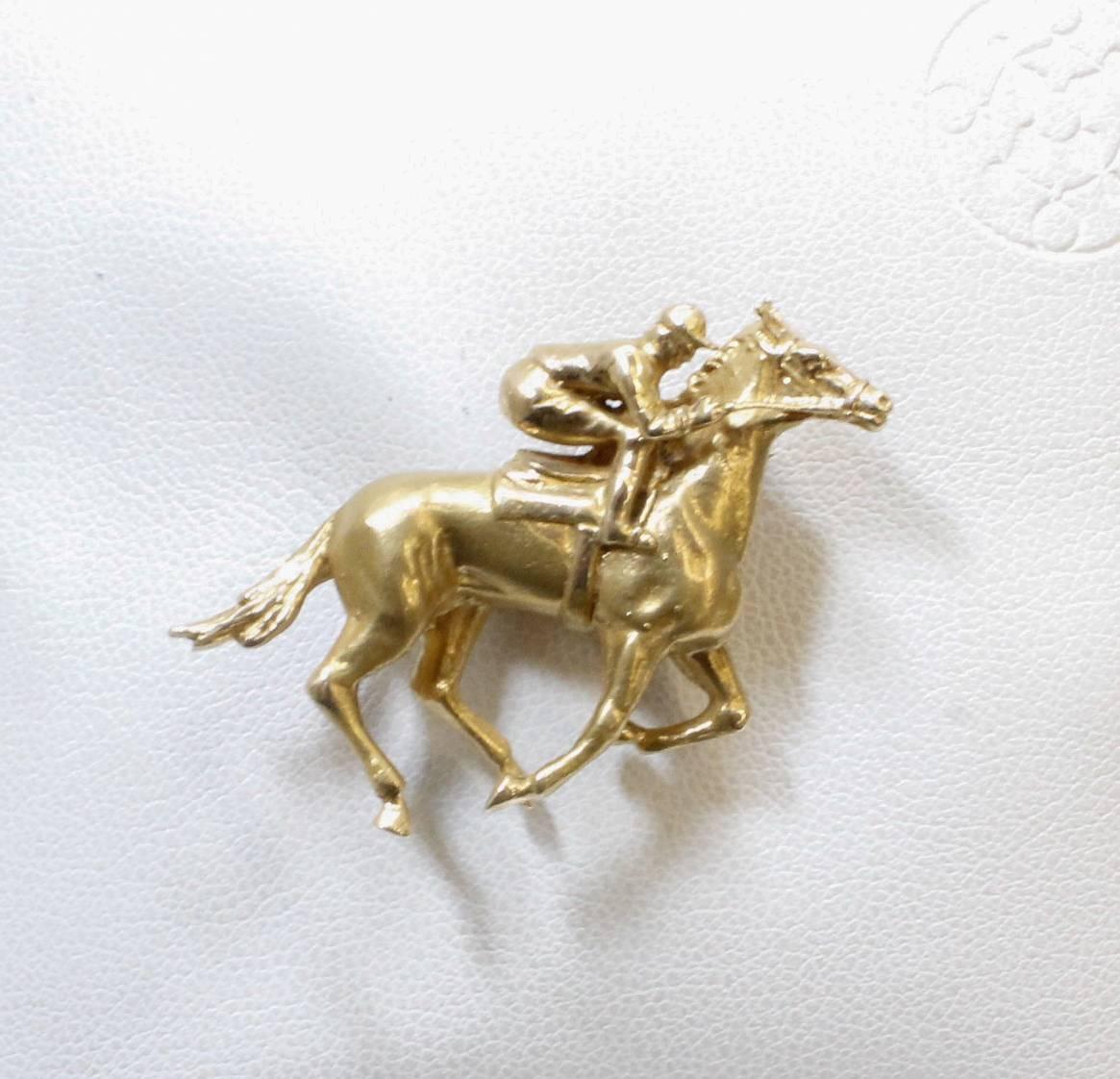 14 kt. yellow/gold horse & jockey brooch/pin.