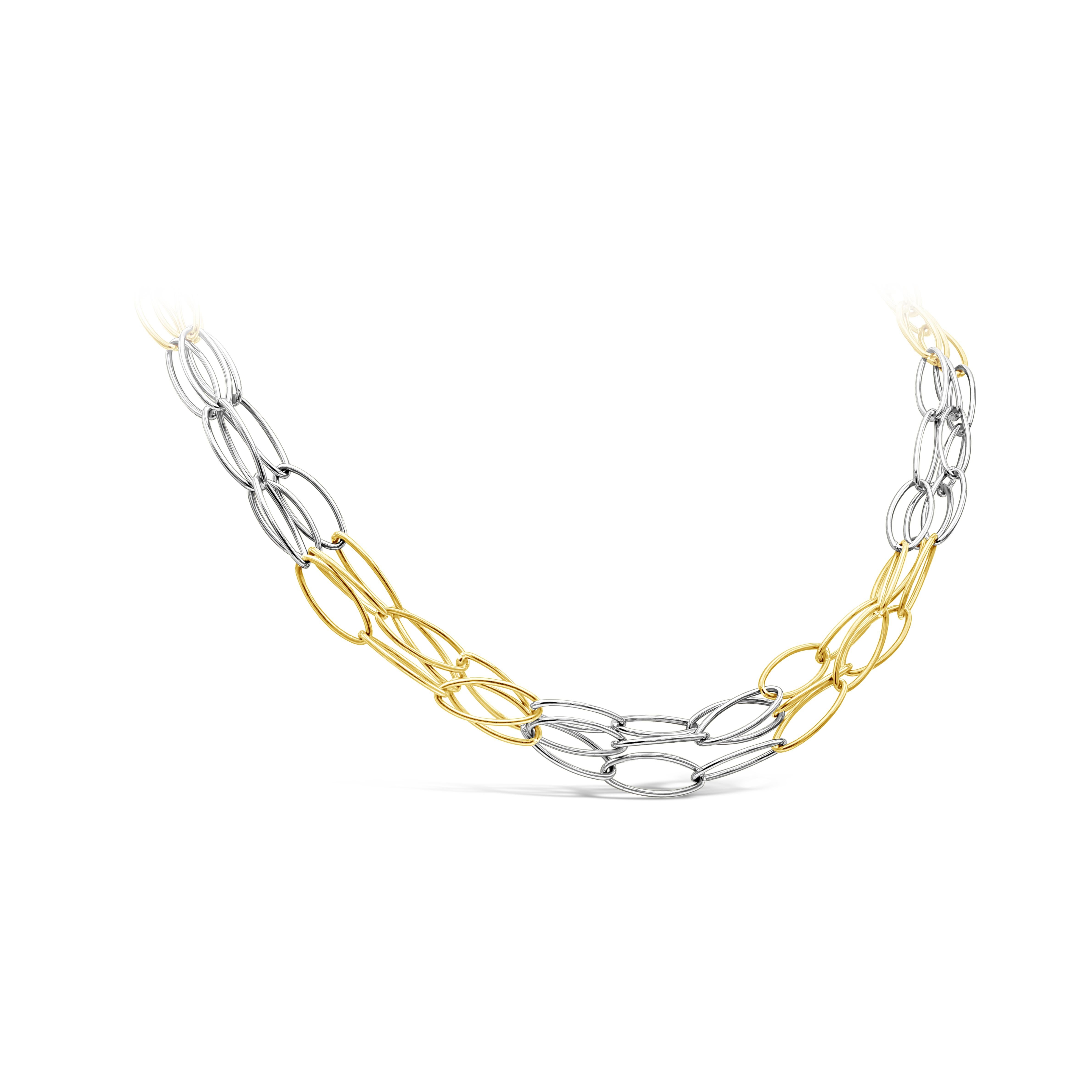 Diese dreifach gegliederte Kette besteht abwechselnd aus drei langen ovalen Gliedern aus 14 Karat Weißgold und drei langen ovalen Gliedern aus 14 Karat Gelbgold. Das Gewicht dieses komplizierten Designs beträgt 18,20 Gramm.