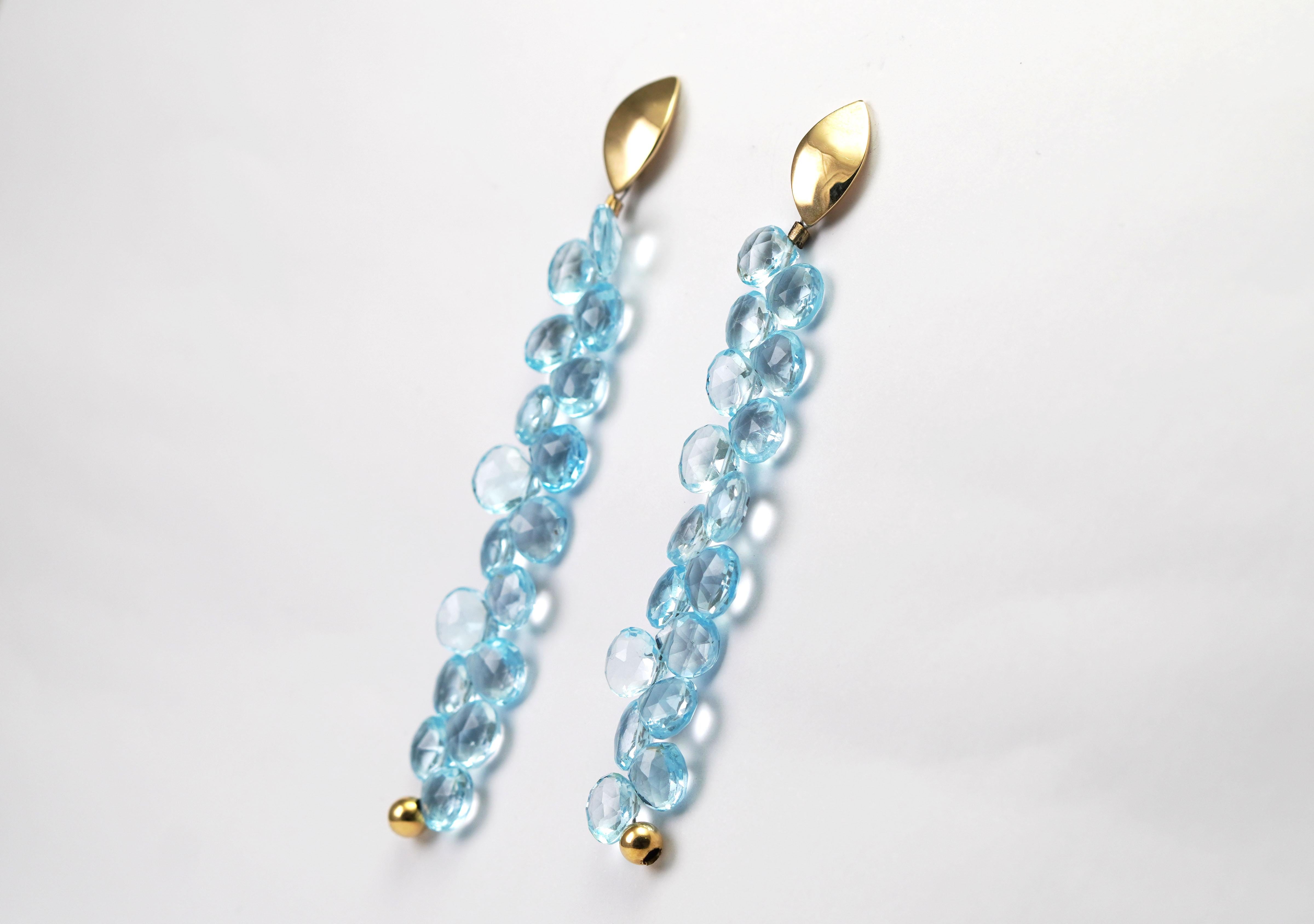 14 kt gold pair of earrings with Blue Topaz
Gold color: Yellow
Dimensions: 75 mm width
Total weight: 9.96 grams

Set with:
- Topaz x 34
Cut: Rose
Colour: Blue