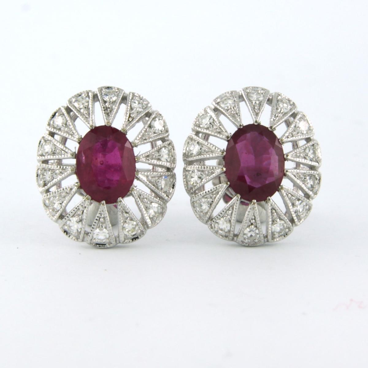 14 kt white gold earrings set with ruby 2.90 carat and single cut diamond total 0.48 carat - F/G - VS/SI

detailed description

The earrings are 1.4 cm wide and 1.7 cm high

weight: 5.5 grams

set with :

- 2 x 8.0 mm x 6.0 mm oval facet cut heated