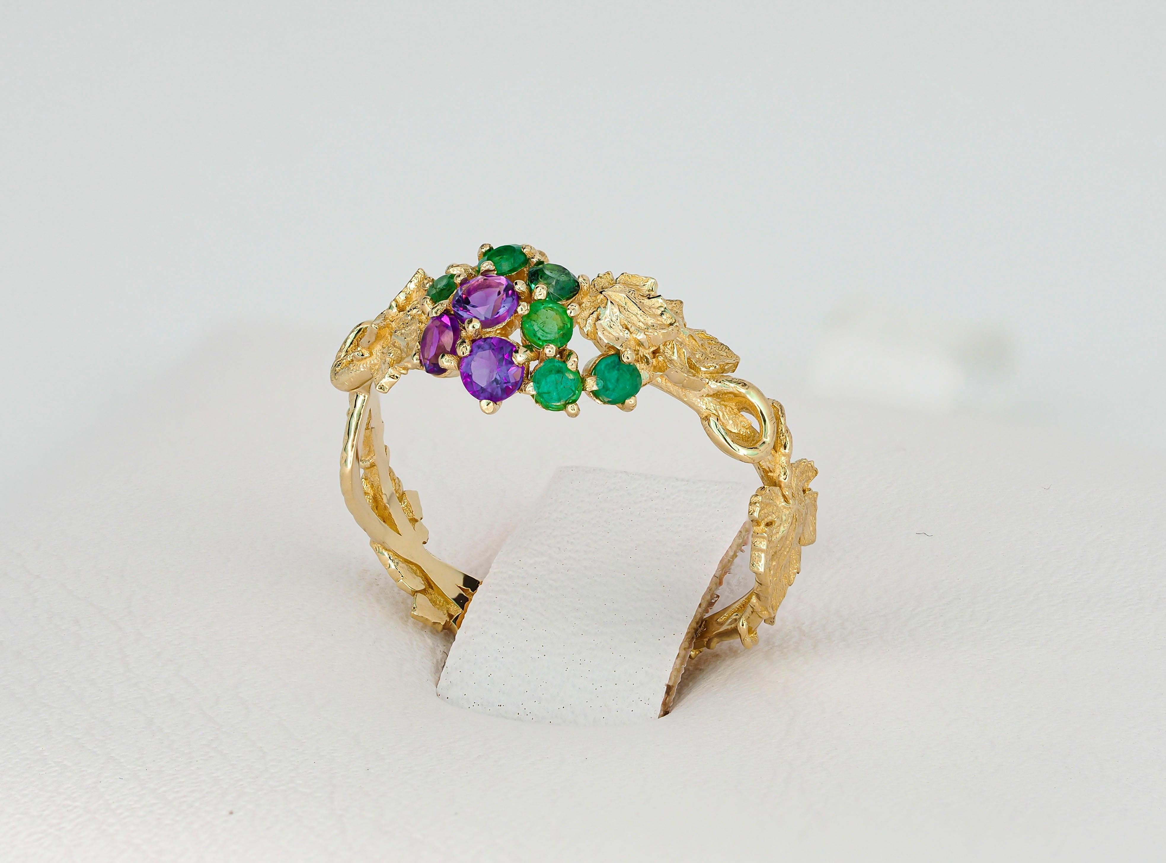 14 kt  gold ring with natural amethysts and emeralds. Grape tree design ring. February birthstone. May birthstone.
Weight approx. 1.96 g.
Metal: 14kt solid gold 

Gemstones
1. Natural amethysts:
Total weight: 0.24 ct (0.08 ct x 3 pieces), round