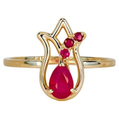 14 kt gold ring with ruby and side rubies. Gold tulip flower ring.