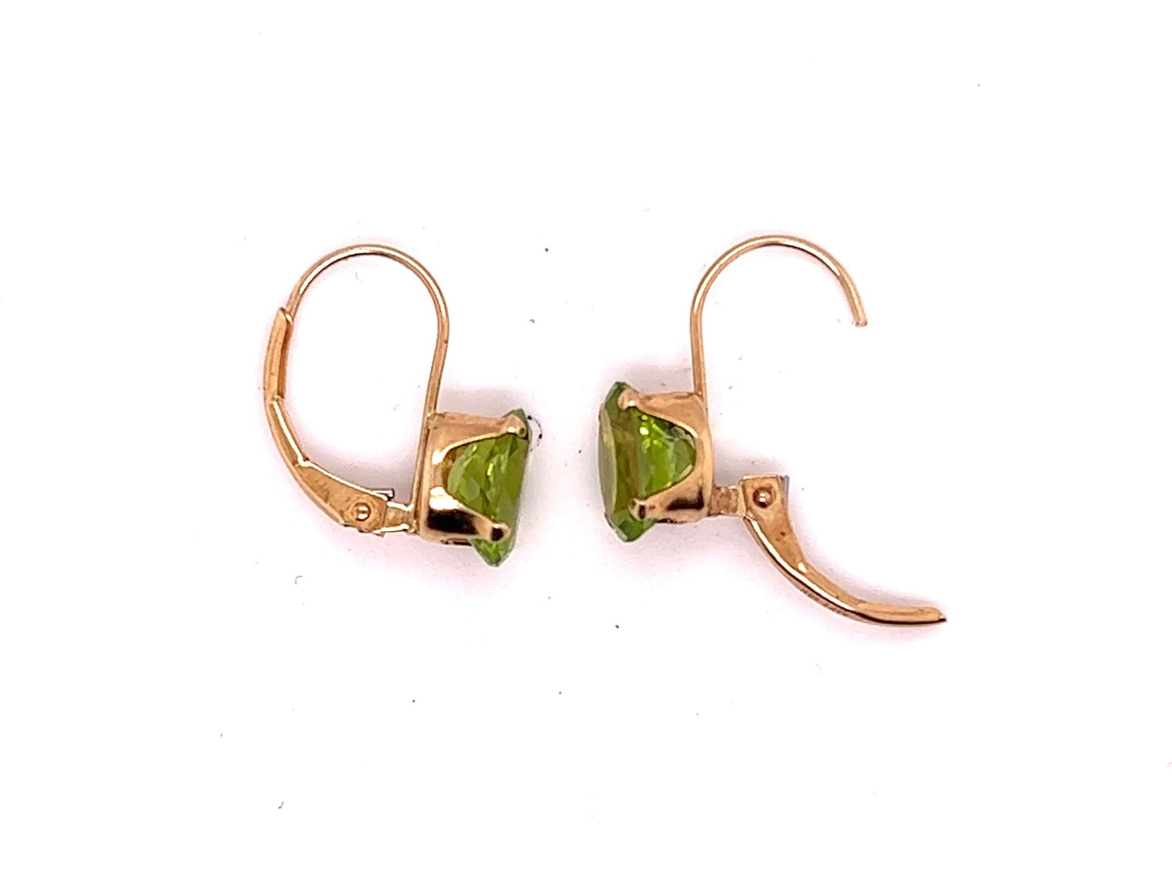 14 KT Yellow Gold 3.24 total carat weight Peridot Lever Back Earrings.

The earrings hang 5/8 inch in length and the peridots are approx. 5/16 inch long.
