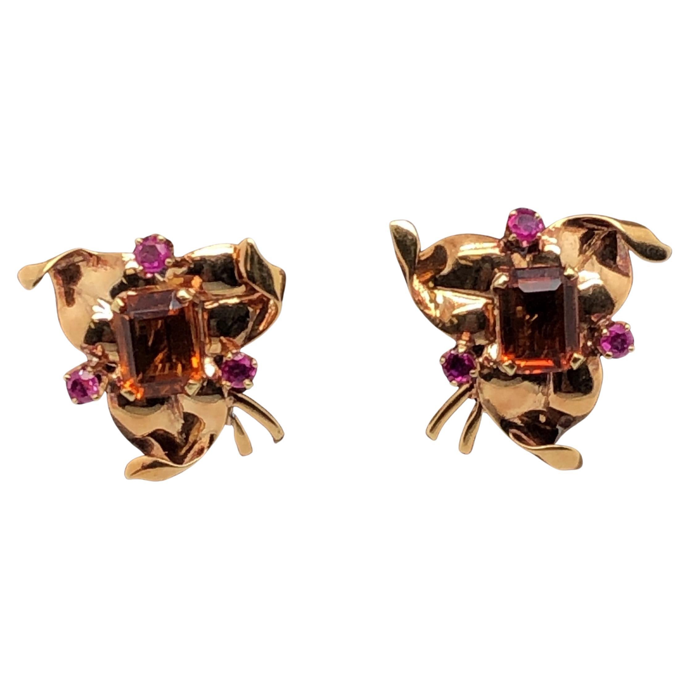 Retro 1940's era Tiffany & Co. screw back earrings with 2.54 total carat weight Citrine and .12 total carat weight Rubies.

The Citrine is 5/16 inch x 3/16 inch.

The earrings are three sided, approx. 7/8 inch on each side.

Tiffany & Co. stamp is