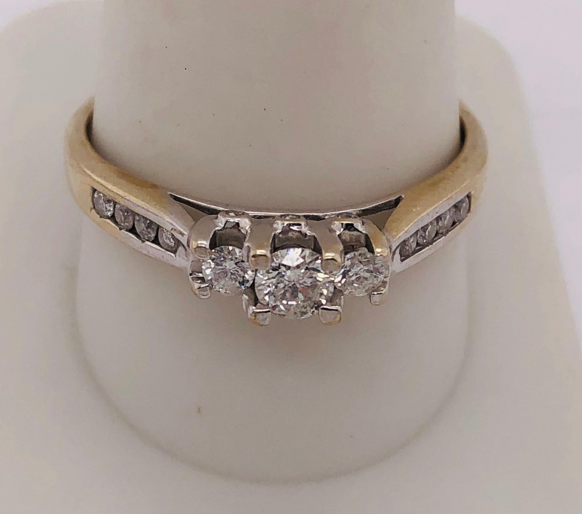 14 Kt Two Tone Yellow And White Gold Engagement Wedding Bridal Ring 1.00 TDW 
Size 11  
2.49 grams total weight.