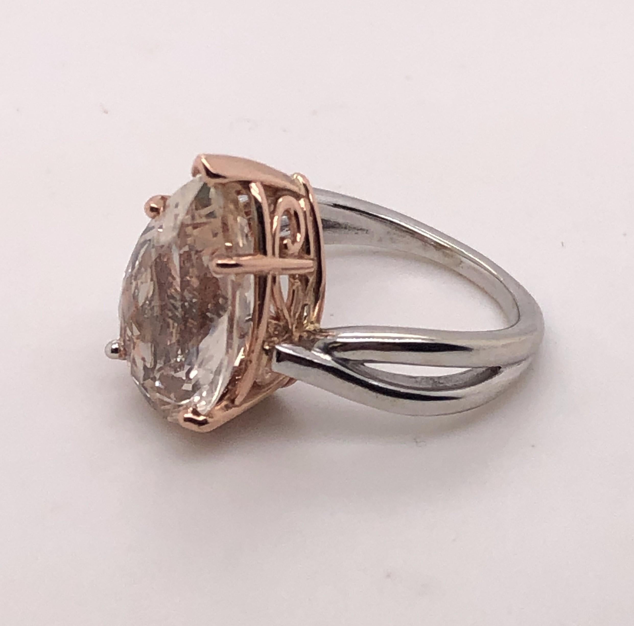 14 KT White and Rose Gold 8.14 carat Pear Shaped Pink Topaz ring. 

The ring is size 6.5.

The Topaz measures approx. 11/16 inch tall and 7/16 inch wide at the base.