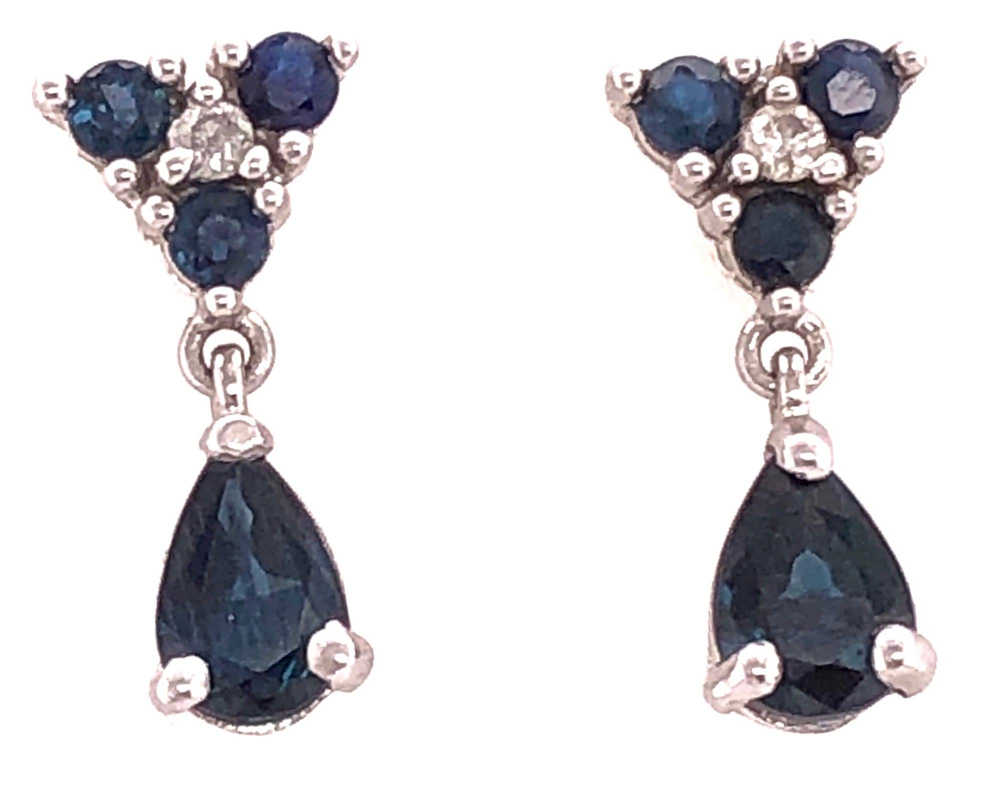 14Kt White Gold Blue Sapphire Earrings 0.02 Total Diamond Weight.
1.47 grams total weight 19.50mm high.
16 mm long by 6.7 mm wide