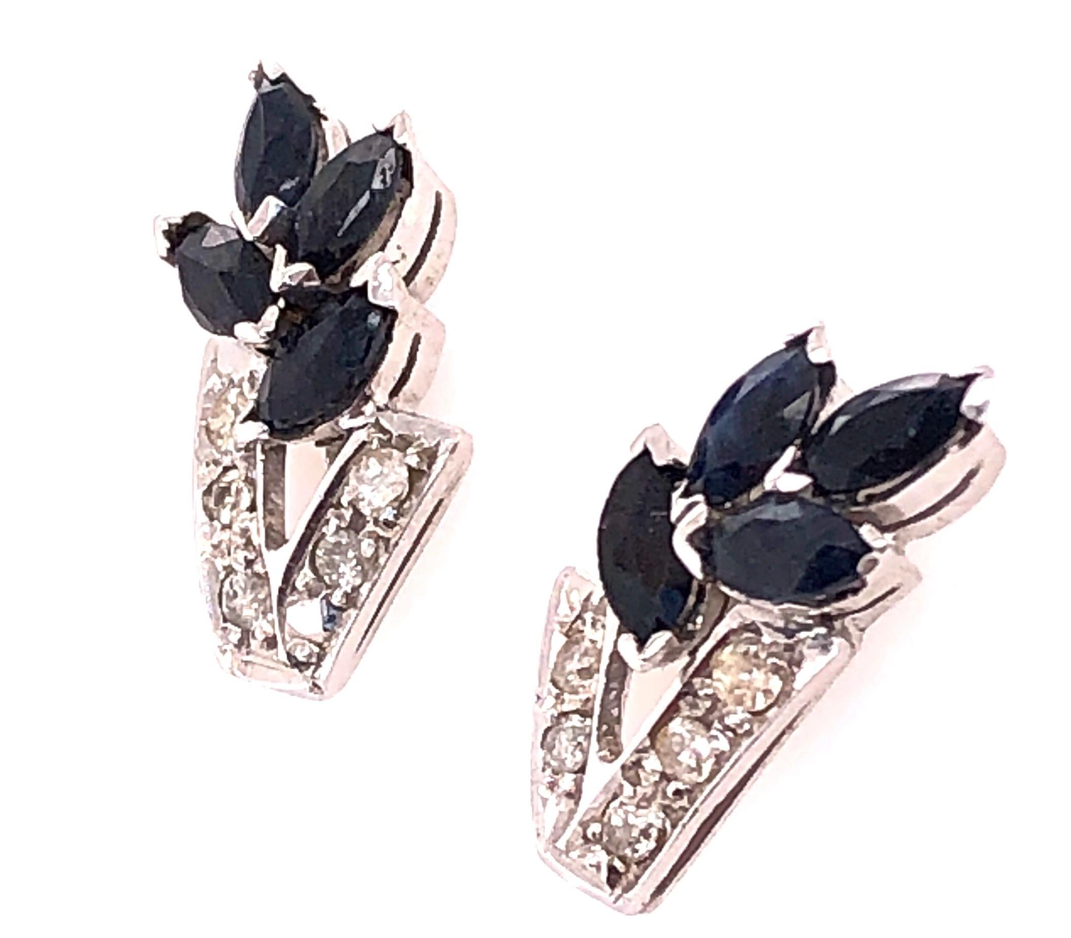 14 Kt White Gold Diamond And Sapphire Cluster Earrings 
0.12 Total Diamond Weight.
2.7 grams total weight.