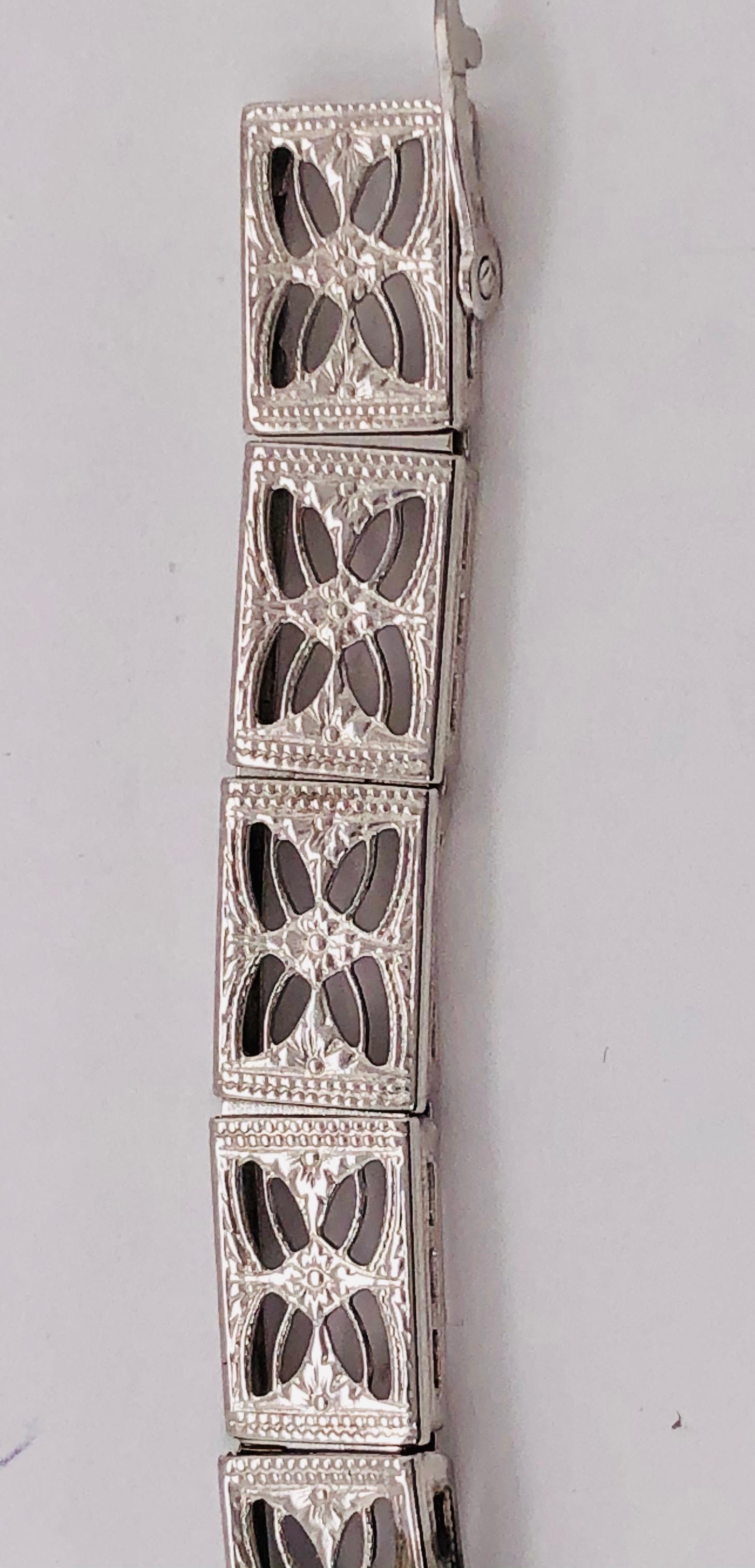 Art Deco 14 Karat White Gold Filigree Link Bracelet with Two Blue Sapphire Accents For Sale