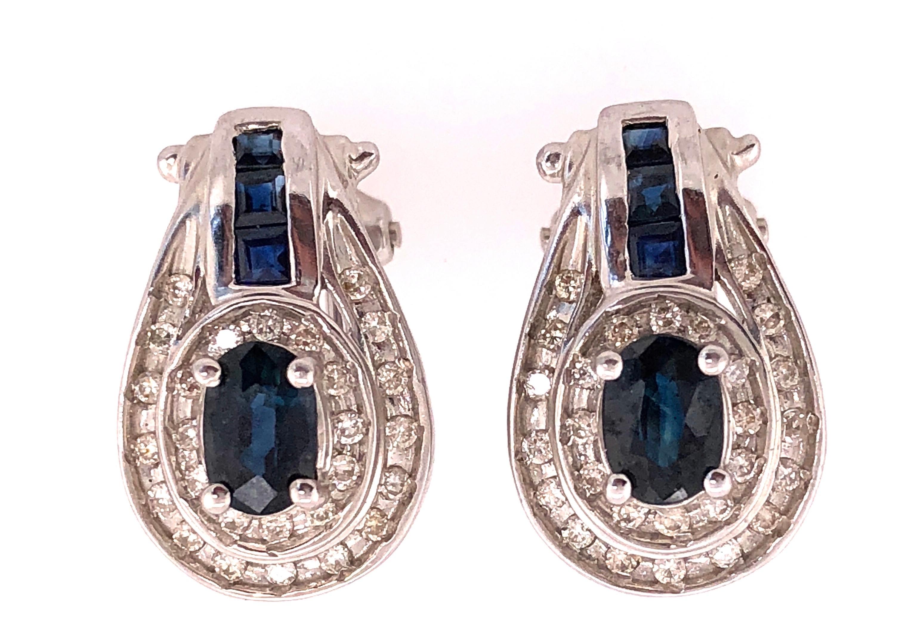 14 Kt White Gold French Back Earrings with Diamonds And Blue Sapphires 1.00 Total Diamond Weight.
6.69 grams total weight.
