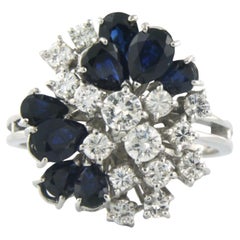 14 kt white gold ring set with sapphire and brilliant cut diamond tot. 1.10 ct