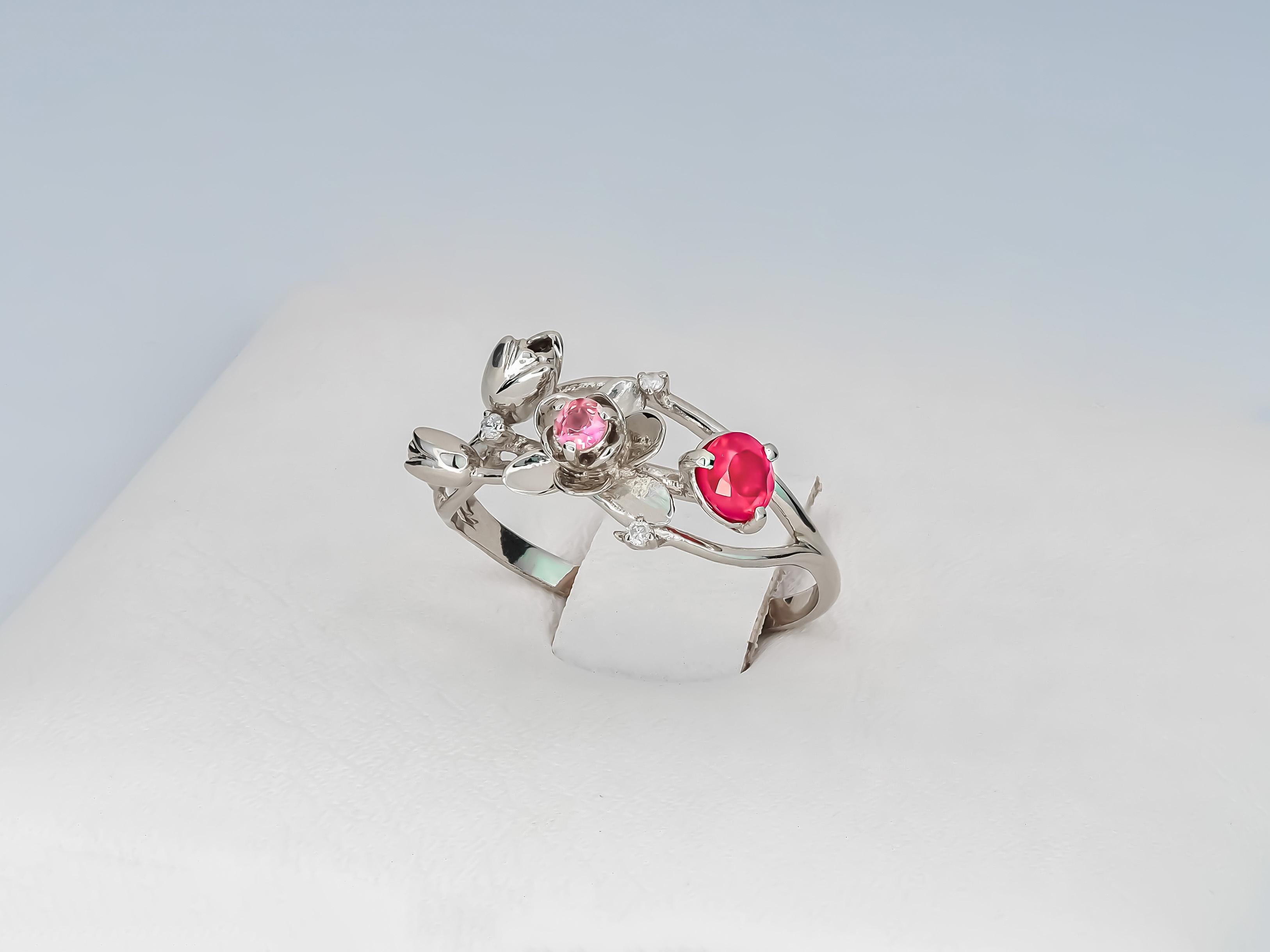 14 karat white gold ring with genuine ruby, sapphire and diamonds. Wild Orchid gold ring. July birthstone.
Weight: 2.2 g. depends from size
Central stone: Genuine ruby
Weight: 0.45 ct in total
Cabochon cut, color - red
Clarity: Transparent with