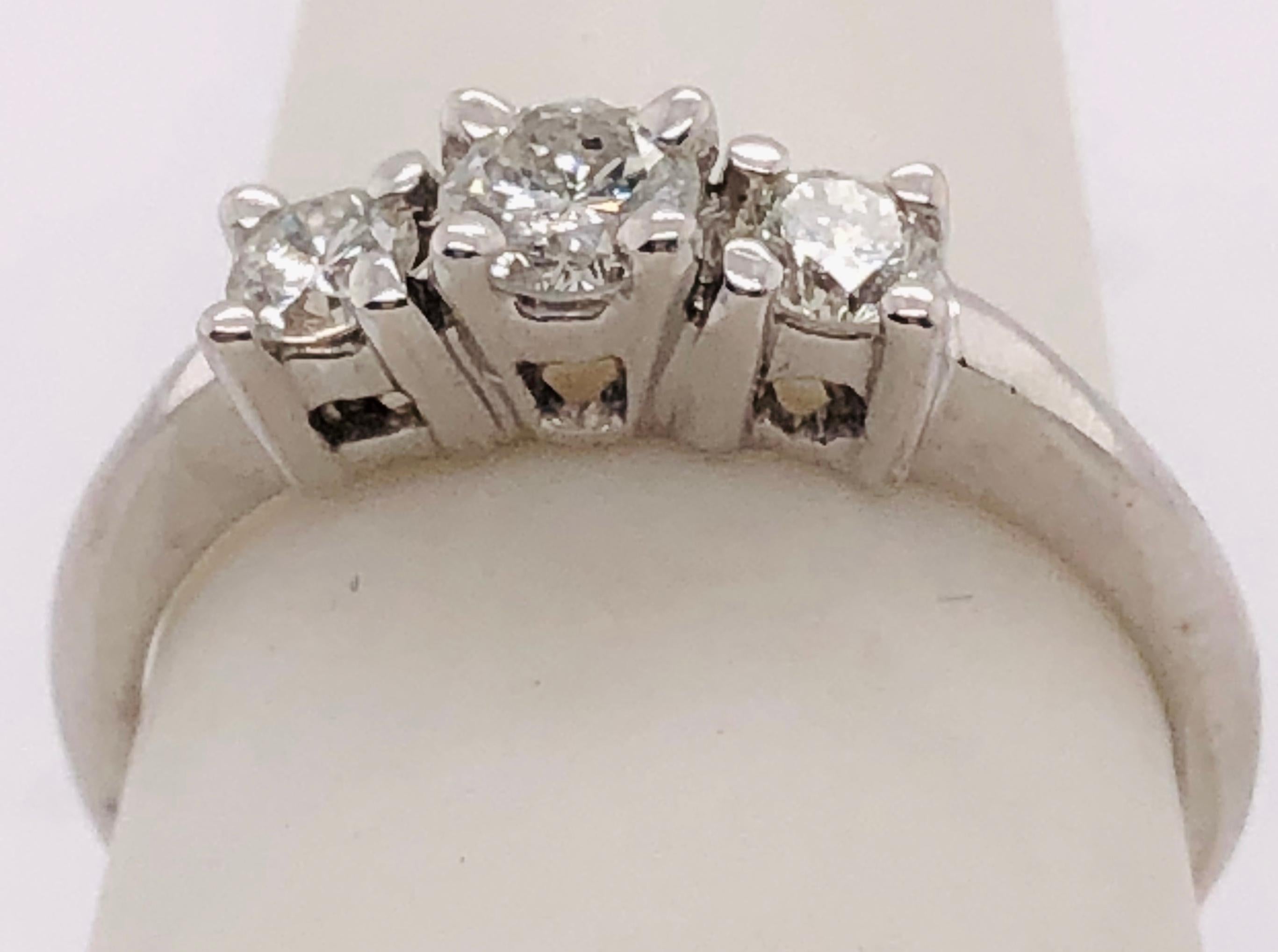 14 Kt White Gold Three Stone Diamond Engagement Anniversary Bridal Ring 0.75 TDW
Size 6.14 
2.62 grams total weight