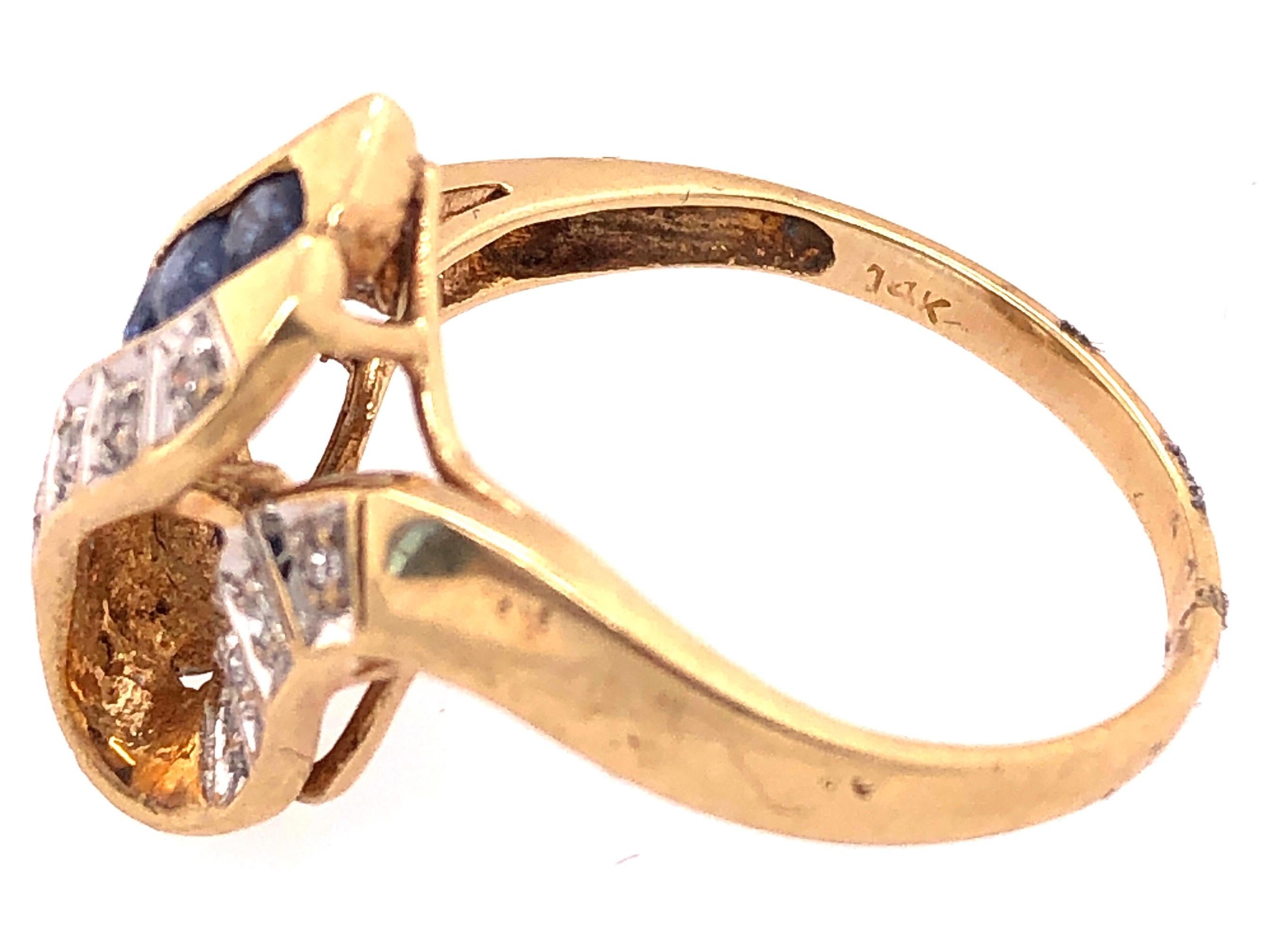 Women's or Men's 14 Karat Yellow and White Gold Blue Sapphire and Diamond Contemporary Ring For Sale