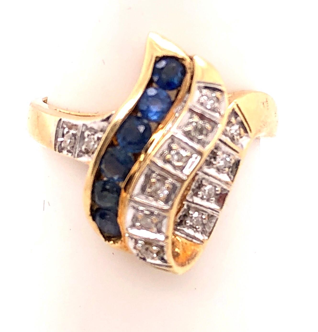 14 Karat Yellow and White Gold Blue Sapphire and Diamond Contemporary Ring For Sale 1