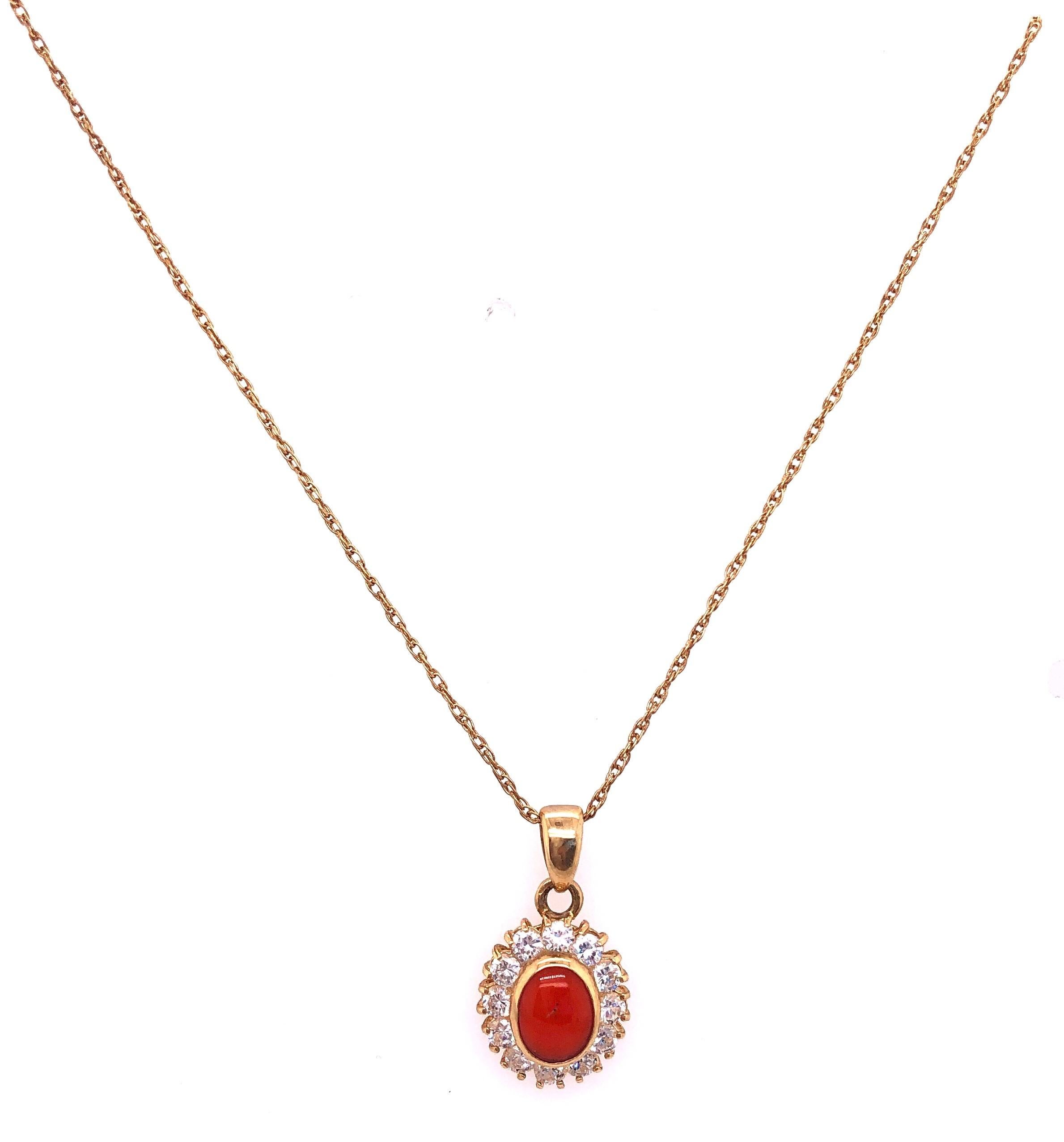 Collana in oro giallo 14 Kt da 18 pollici con ciondolo ovale in corallo e zirconi rotondi 
3,78 grammi di peso totale