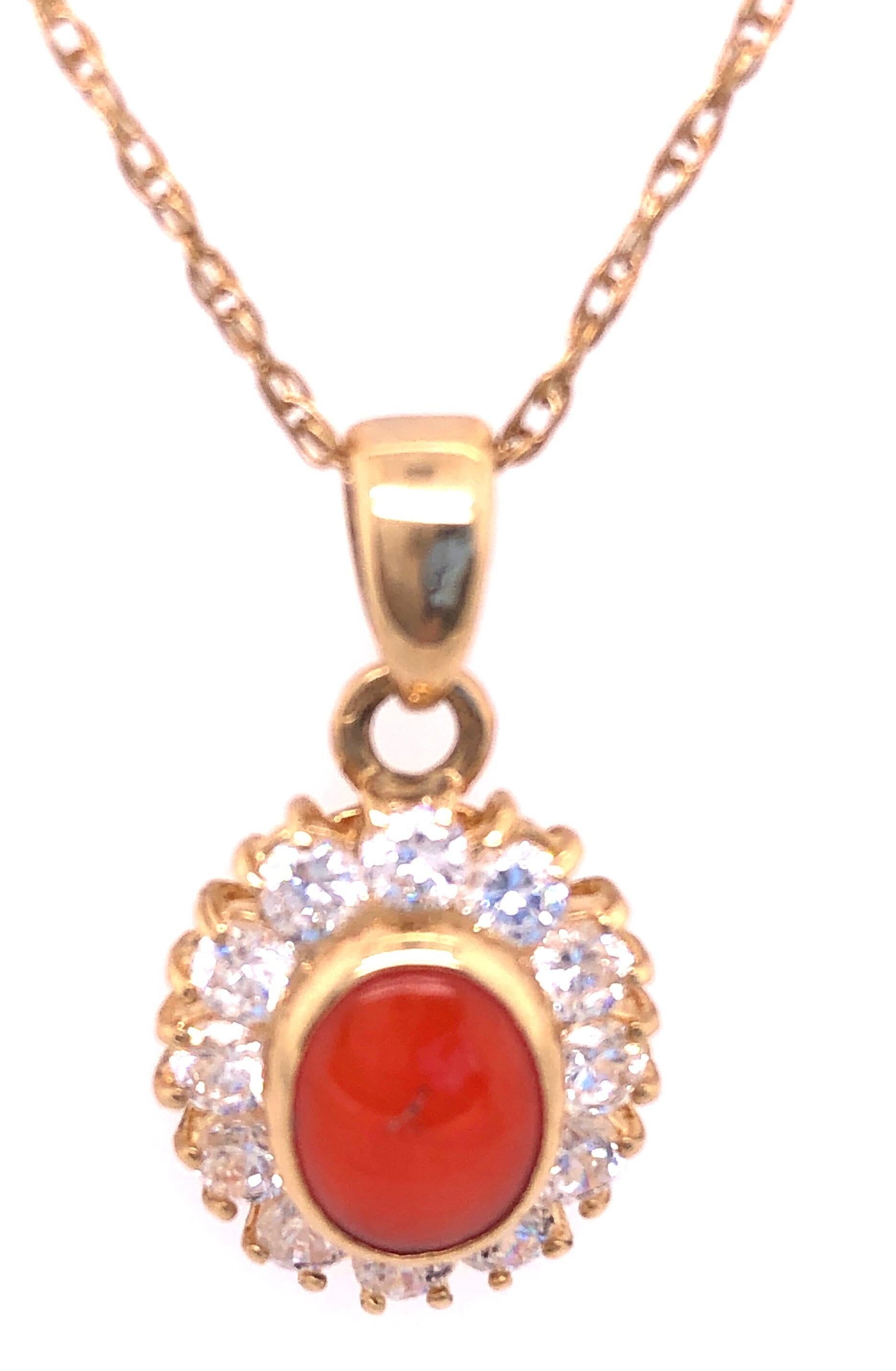 Modern 14 Karat Yellow Gold Necklace with Oval Coral and Round Zirconium Pendant For Sale