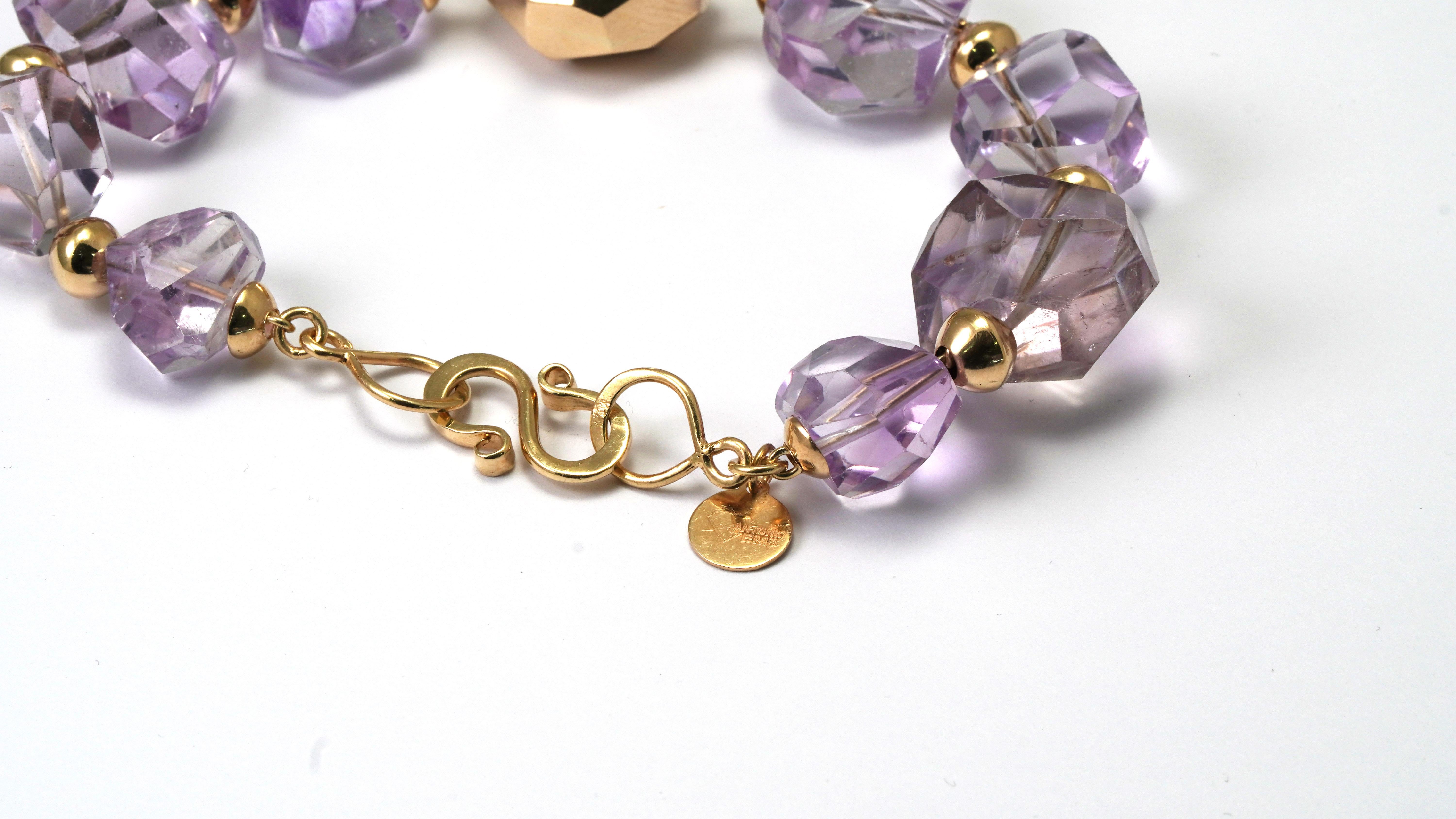 14 kt Yellow Gold Bracelet set with Amethyst.
Gold color: Yellow
Dimensions: 21 cm. (Length) but the Stones are big so
the bracelet is normal Size - Diameter 58 mm.
Total weight: 47.07 grams 

Set with:
- Amethyst
Cut: Fancy
Color: Purple