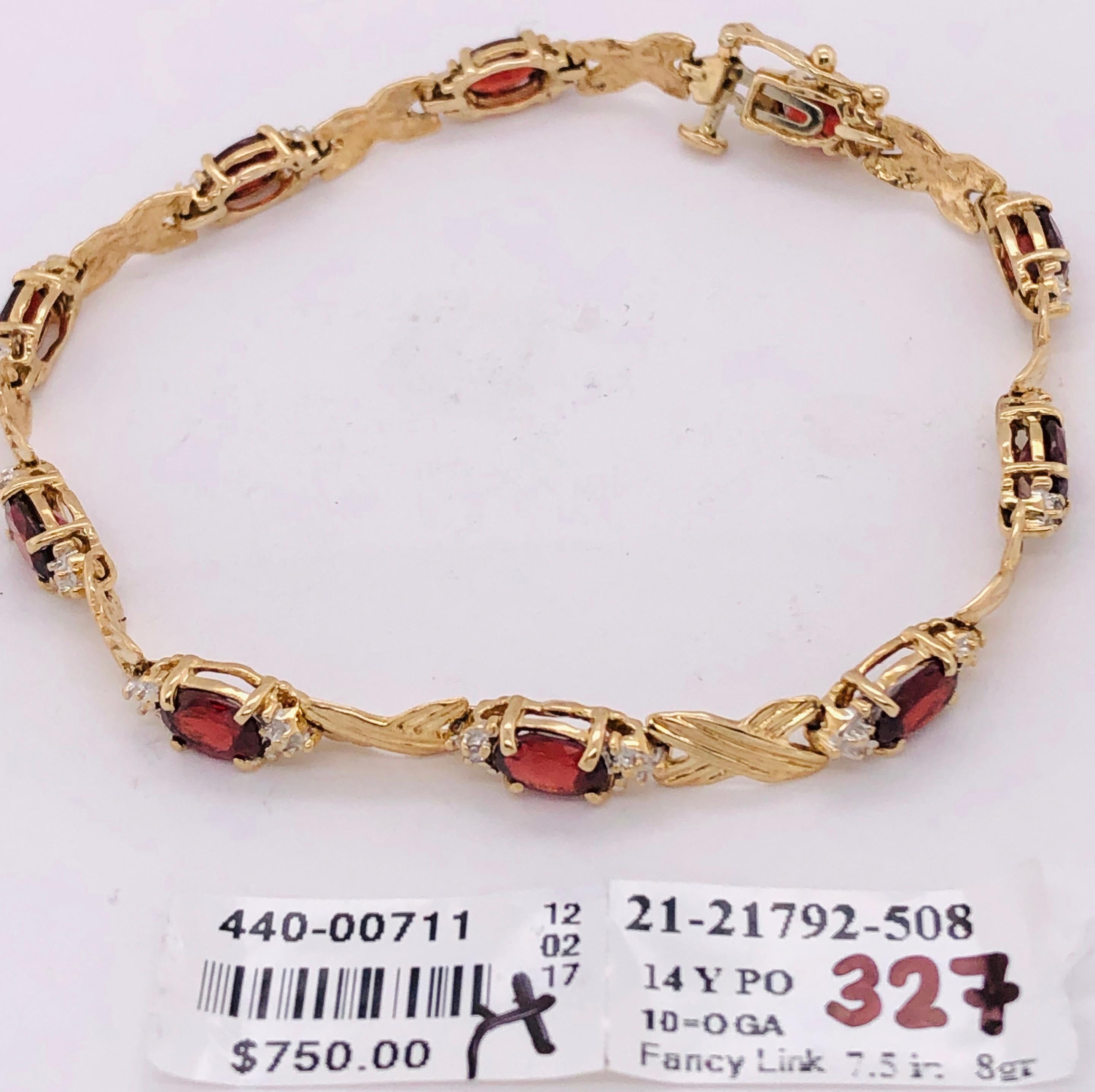 14 Kt Yellow Gold Braided LInk Bracelet With Garnets And Diamond Accents
8 grams total weight.
