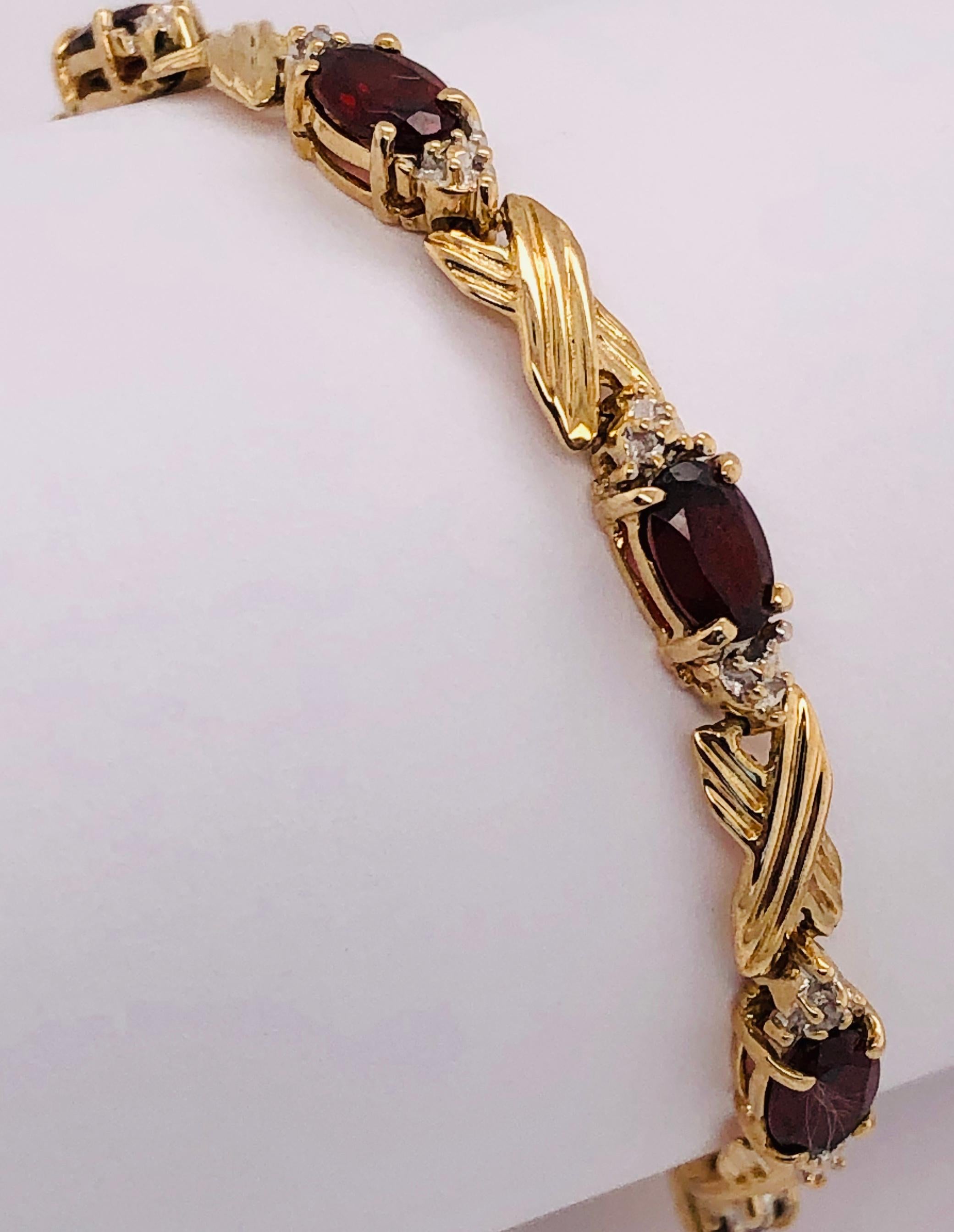 Modern 14 Karat Yellow Gold Braided Link Bracelet with Garnets and Diamond Accents For Sale