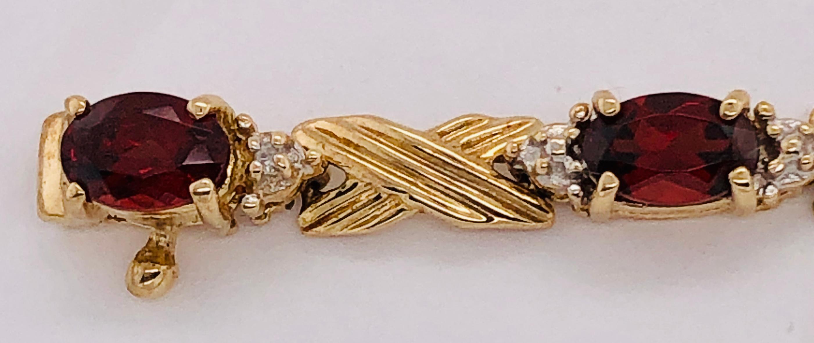 14 Karat Yellow Gold Braided Link Bracelet with Garnets and Diamond Accents In Good Condition For Sale In Stamford, CT