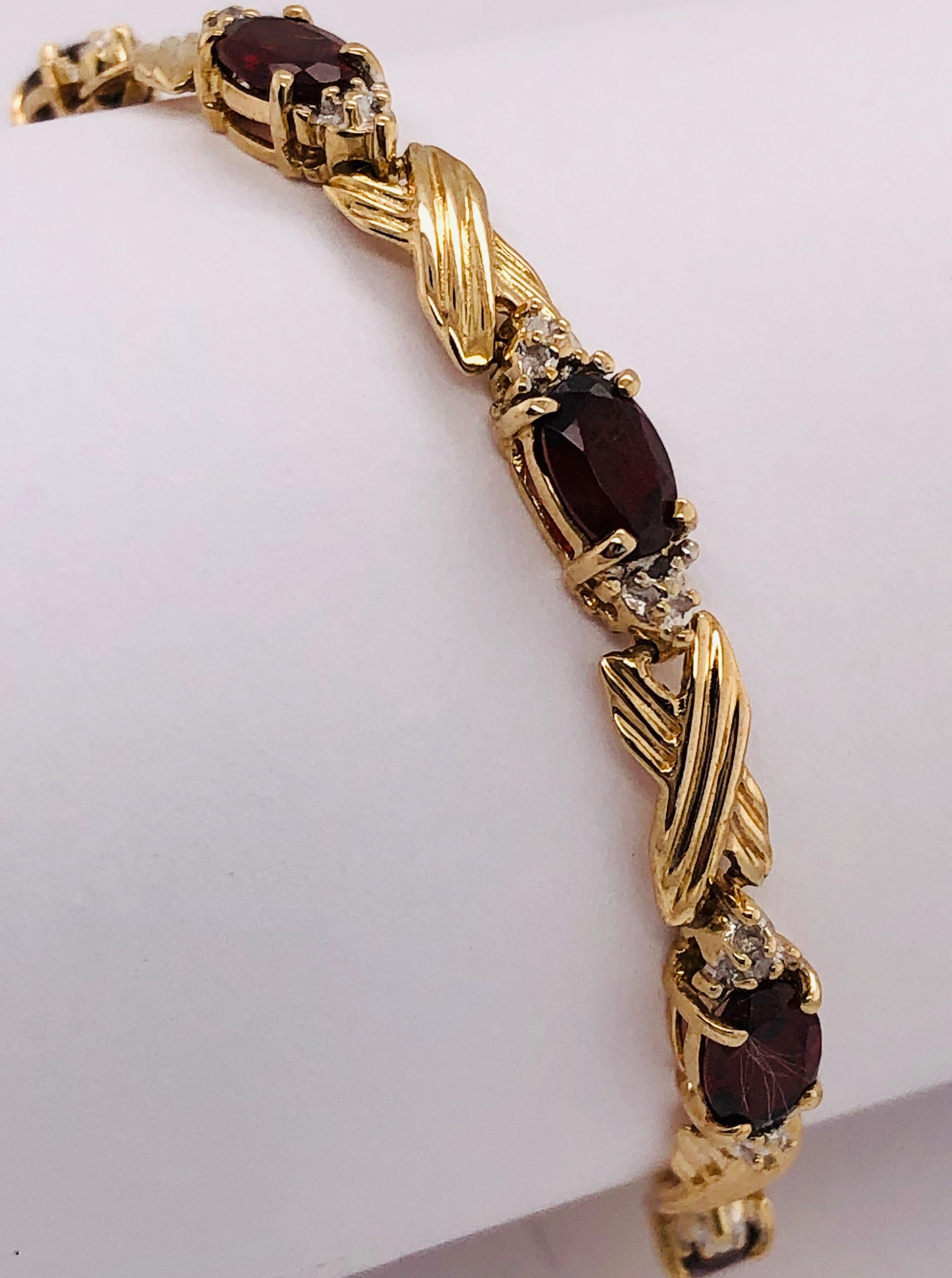 Women's or Men's 14 Karat Yellow Gold Braided Link Bracelet with Garnets and Diamond Accents For Sale