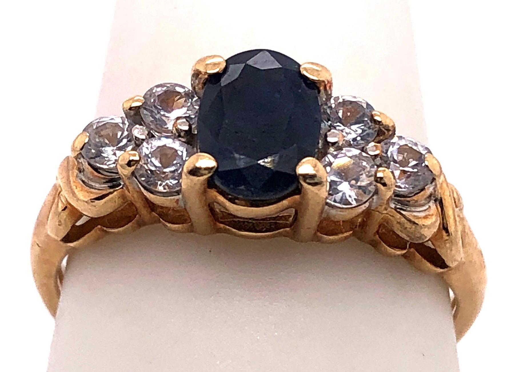 14 Karat Gold Fashion Ring Center Oval Sapphire and Diamond Accent 0.50 TDW In Good Condition For Sale In Stamford, CT