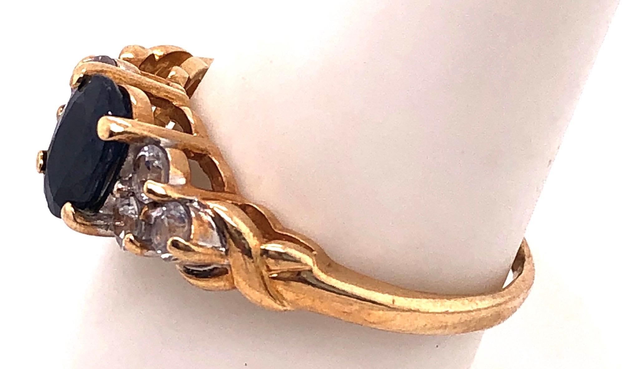 14 Karat Gold Fashion Ring Center Oval Sapphire and Diamond Accent 0.50 TDW In Good Condition For Sale In Manhasset, NY