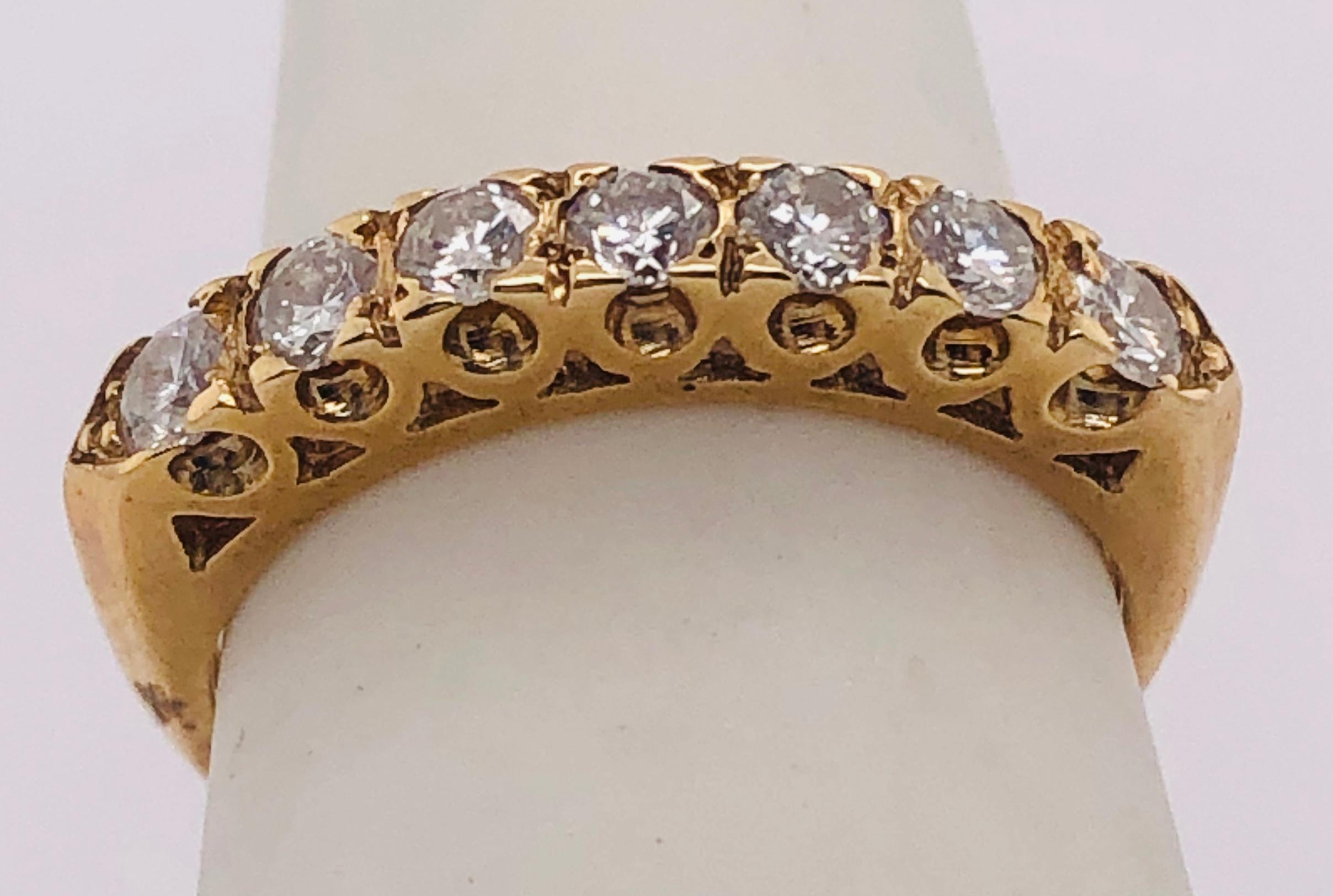 14 Kt Yellow Gold Seven Diamond Anniversary Ring Wedding Band 0.70 Total Diamond Weight
Size 5.5 
2.41 grams total weight