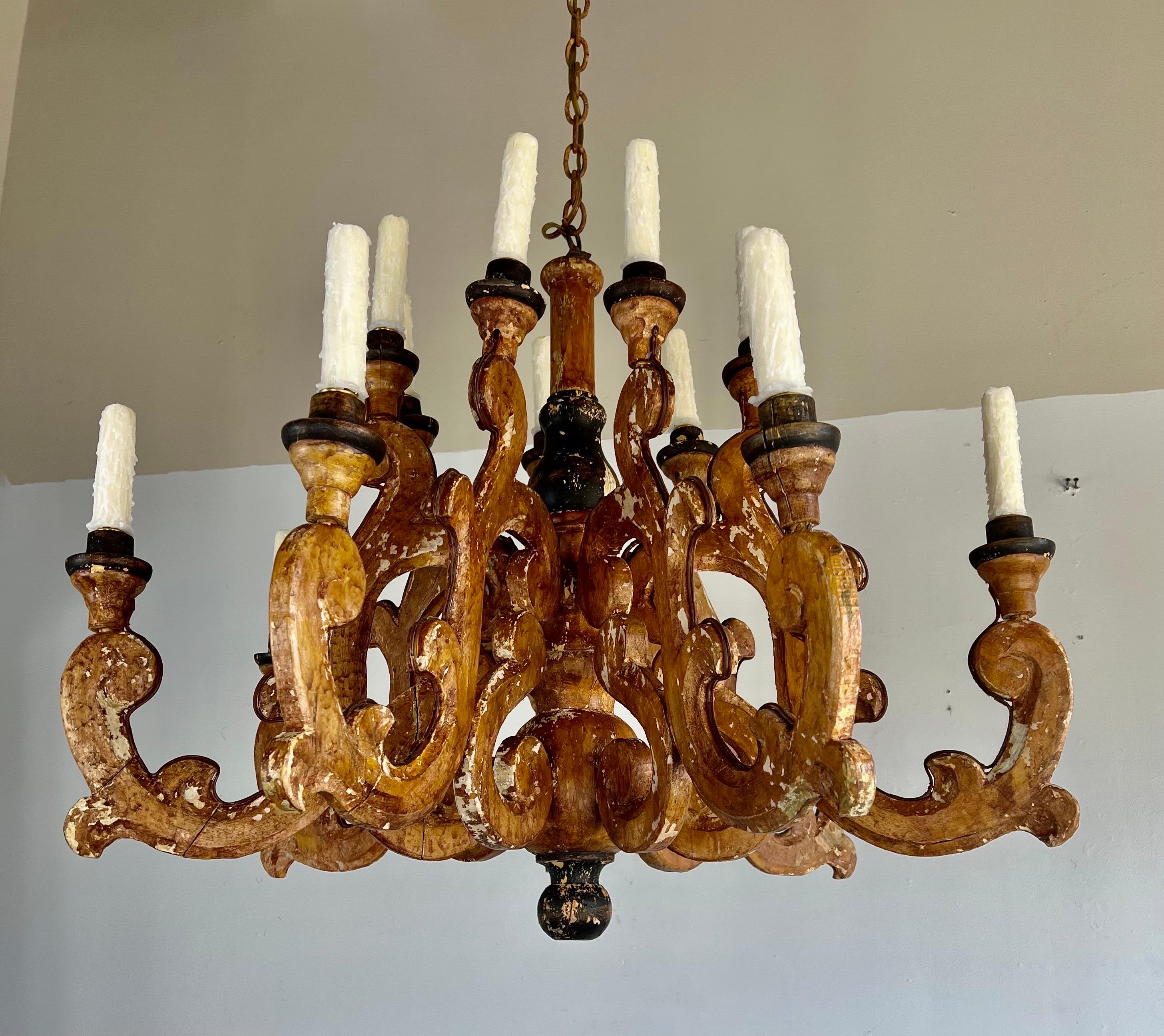 (14) Light painted italian baroque style chandelier. The chandelier has been newly wired with drip wax candle covers. We have added chain & canopy as well.
