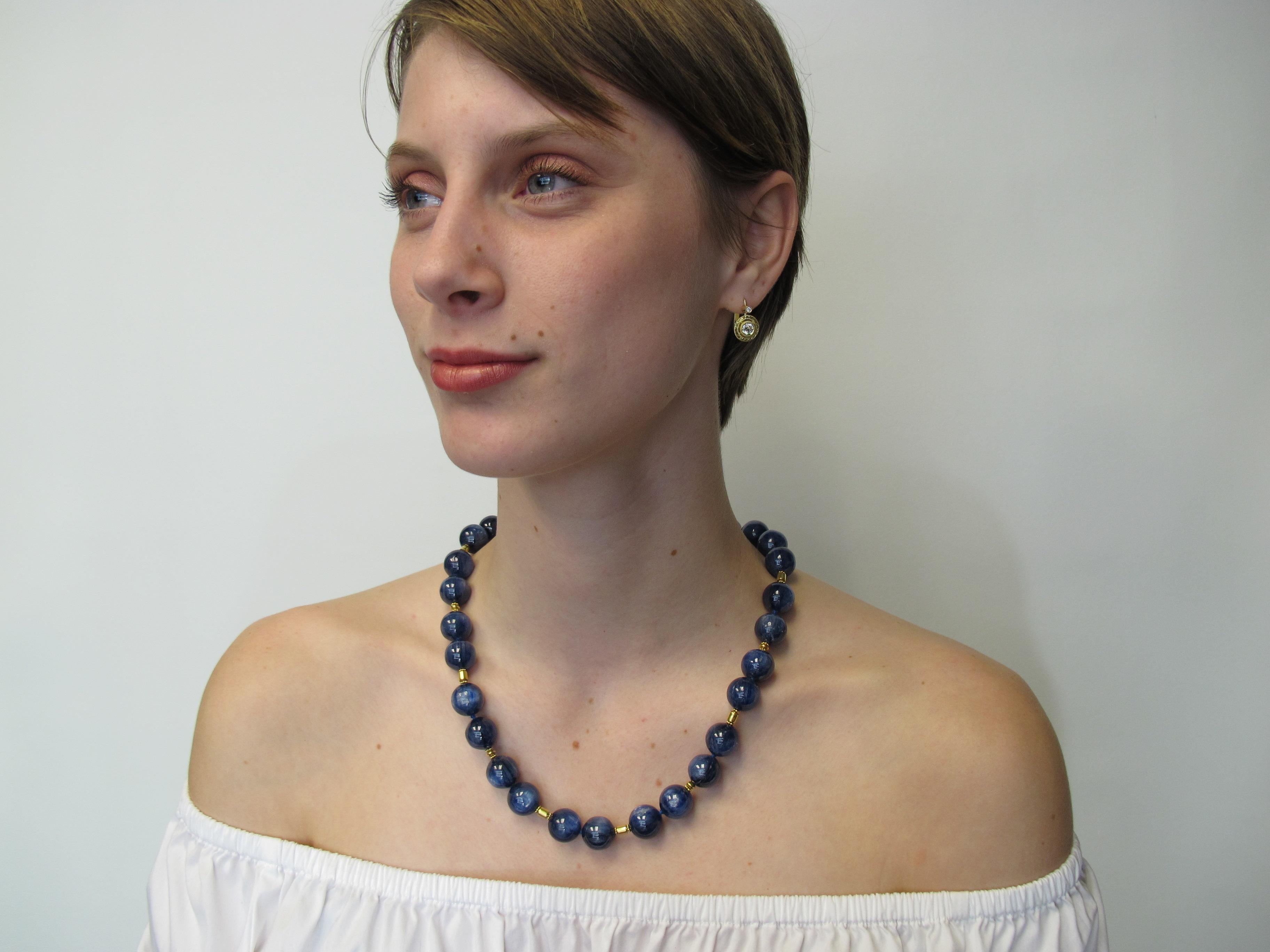 This gorgeous deep denim blue kyanite necklace is a must have!   Each kyanite bead is very large,  measuring  14mm in diameter. Kyanite of this quality and size is extremely rare. It displays a beautiful chatoyancy that makes the necklace positively