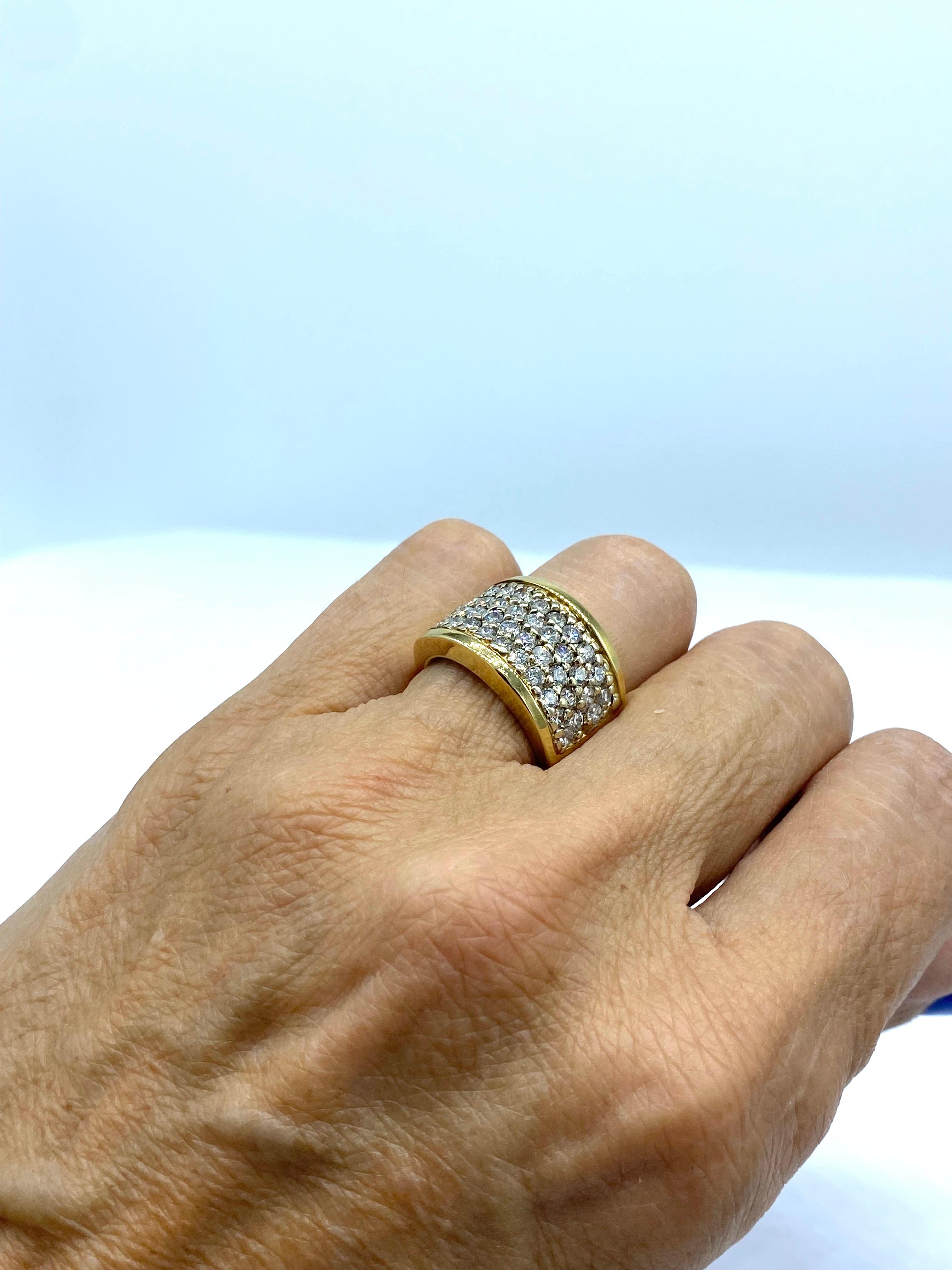 Contemporary Cigar Diamond Band consisting of 
42- round brilliant quality diamonds which are pave set in this heavy, durable ring. Diamonds measure 2.4 mm, having a total weight of 2.10 carats. The setting is durable and well made, with sturdy