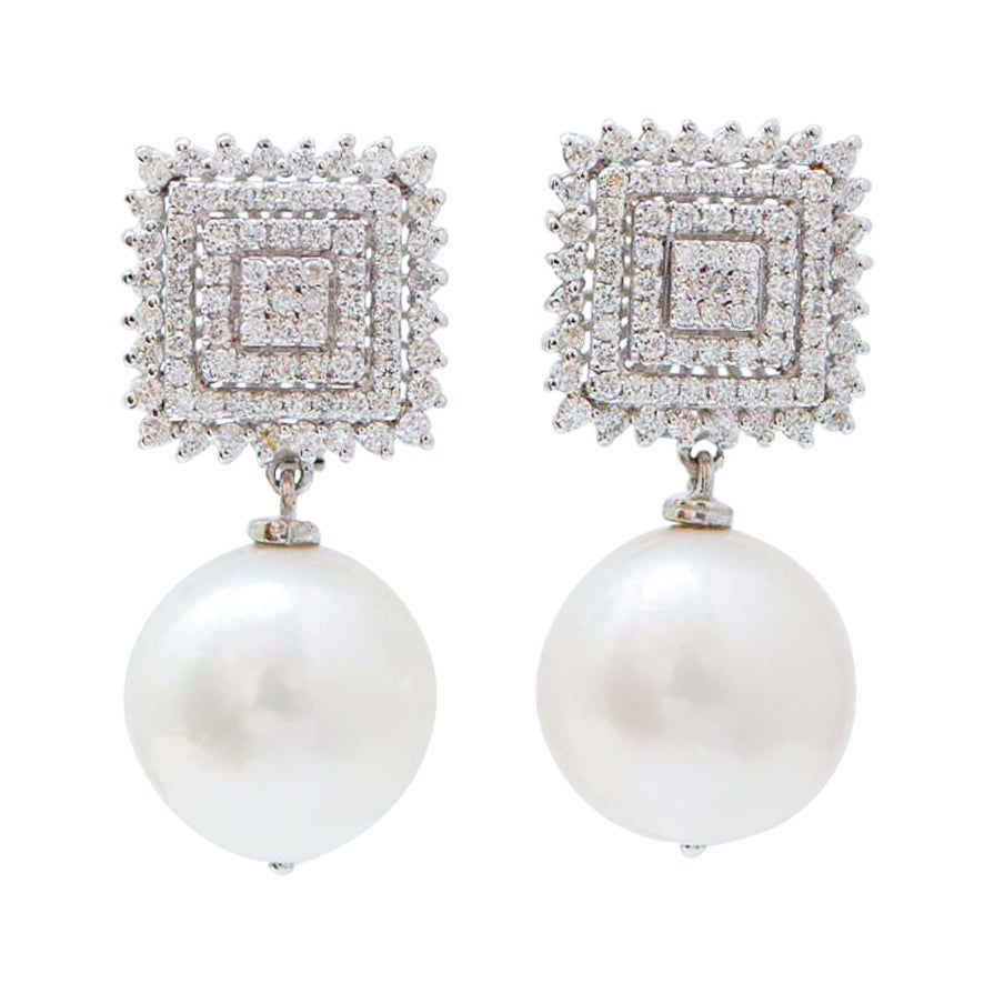 Boucles d'oreilles 14 Mm perles, diamants, or blanc 18 carats.